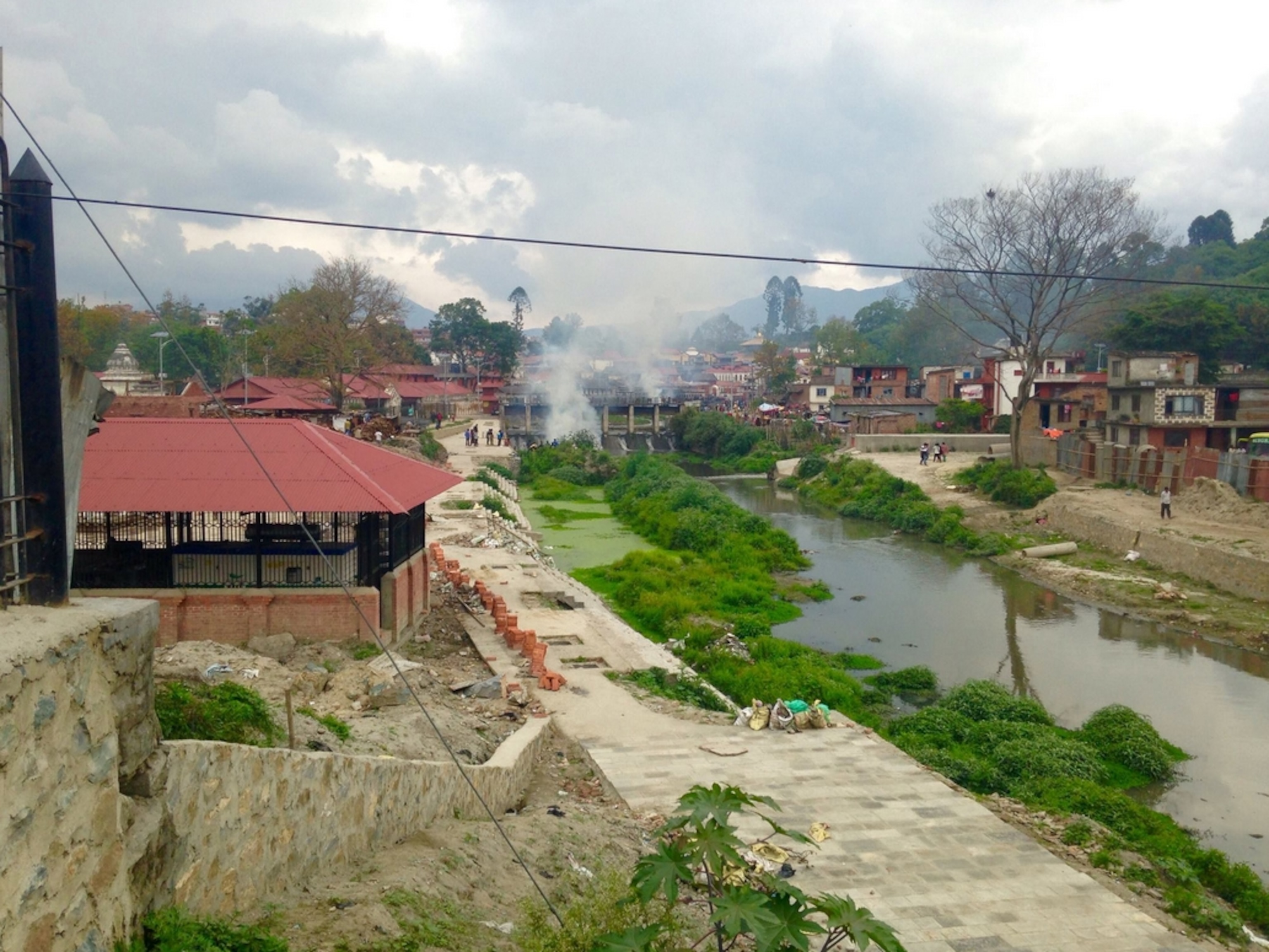 Cremation fires rise from Pashupati; Photograph by Libby Sauter