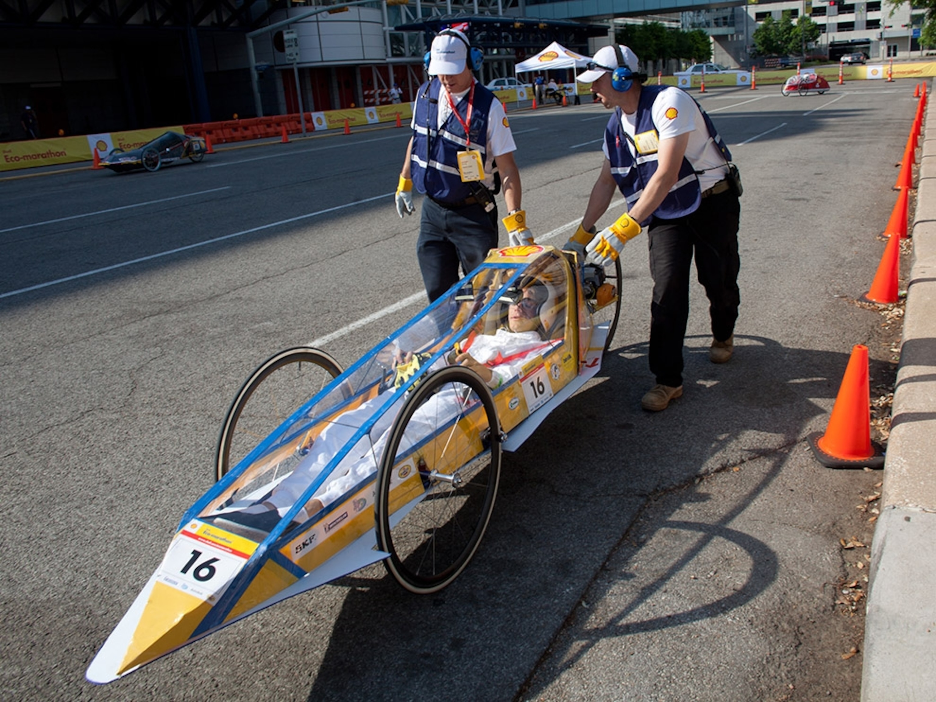 Track officials push Ryan Durr, a junior at St Paul's School in Covington, Louisiana, after the team’s 30-milliliter tank ran out of fuel.