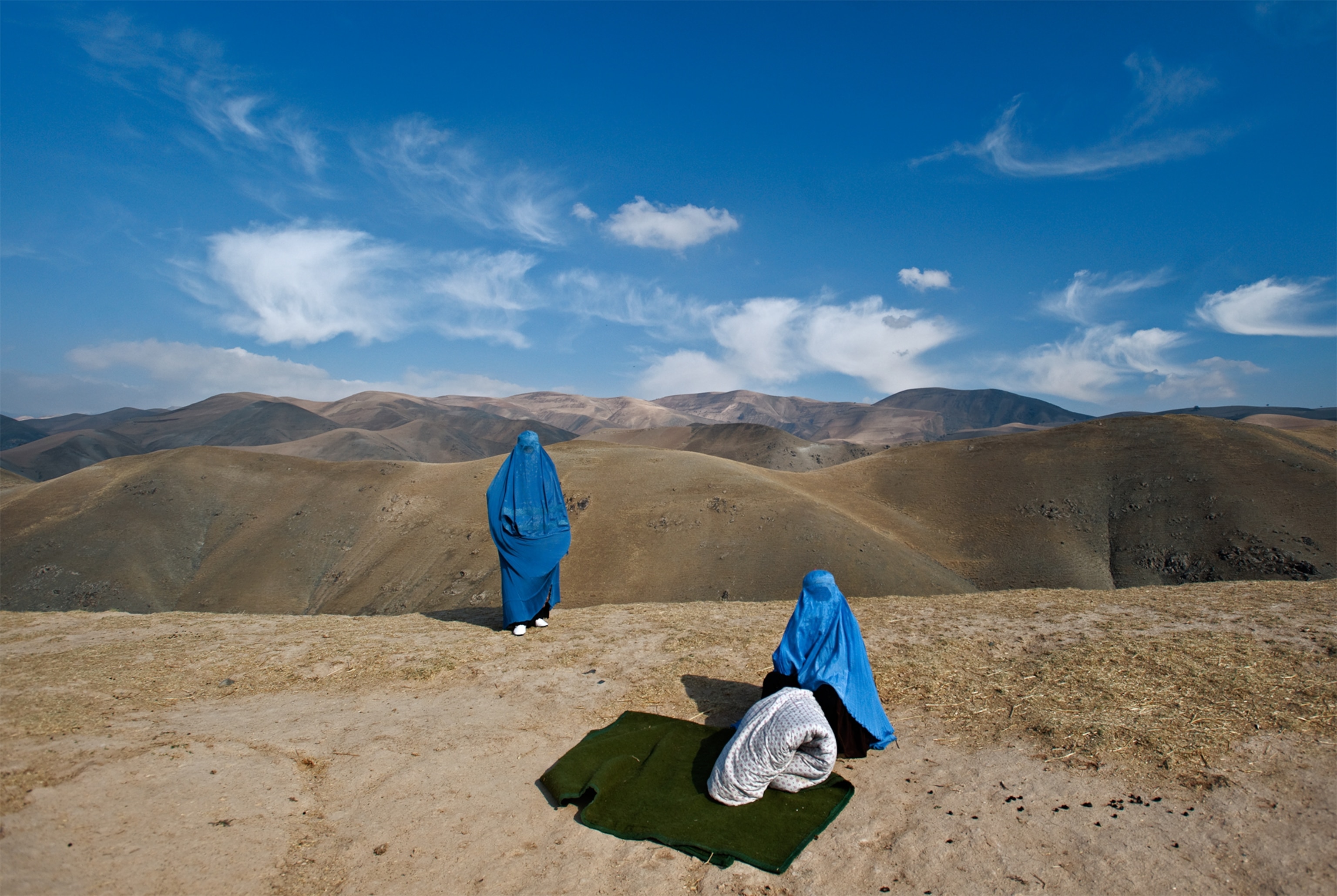a pregnant woman on the side of the road with her water just broken in Afghanistan