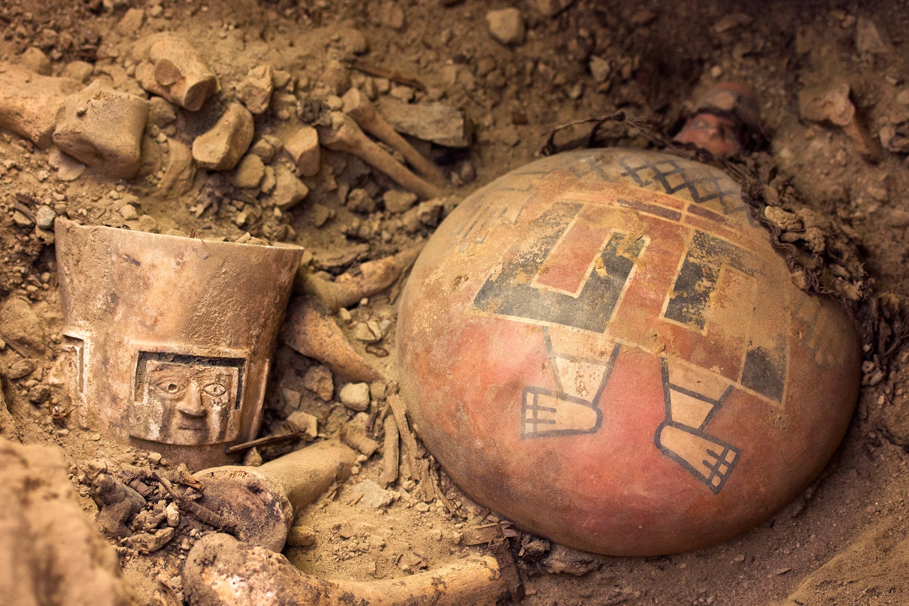 Peru Tomb - A ceramic flask and drinking cup found in an archaeological site in Peru.