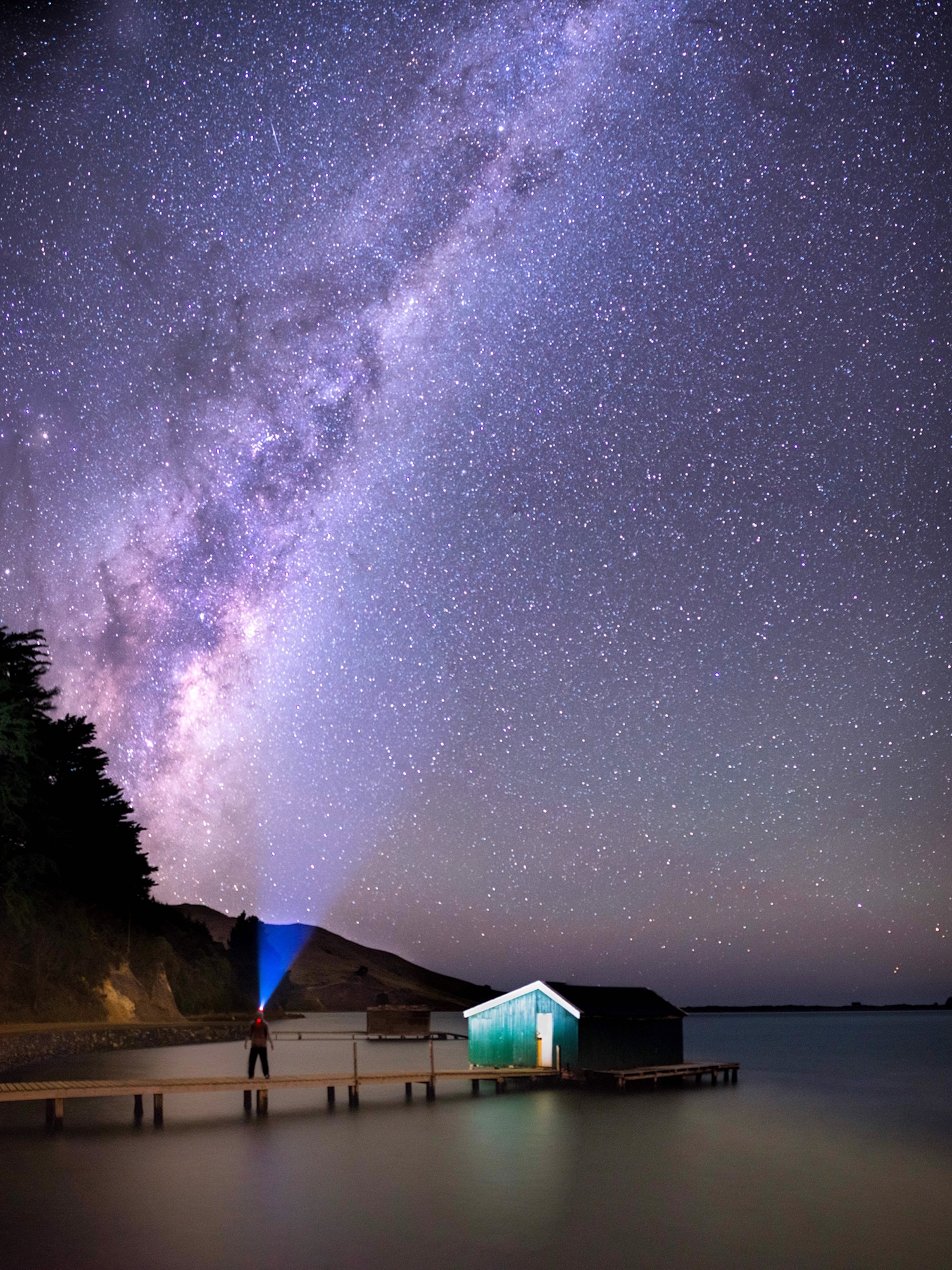 Sam Deuchrass standing on a dock near the Otago Penisula in New Zealand's South Island