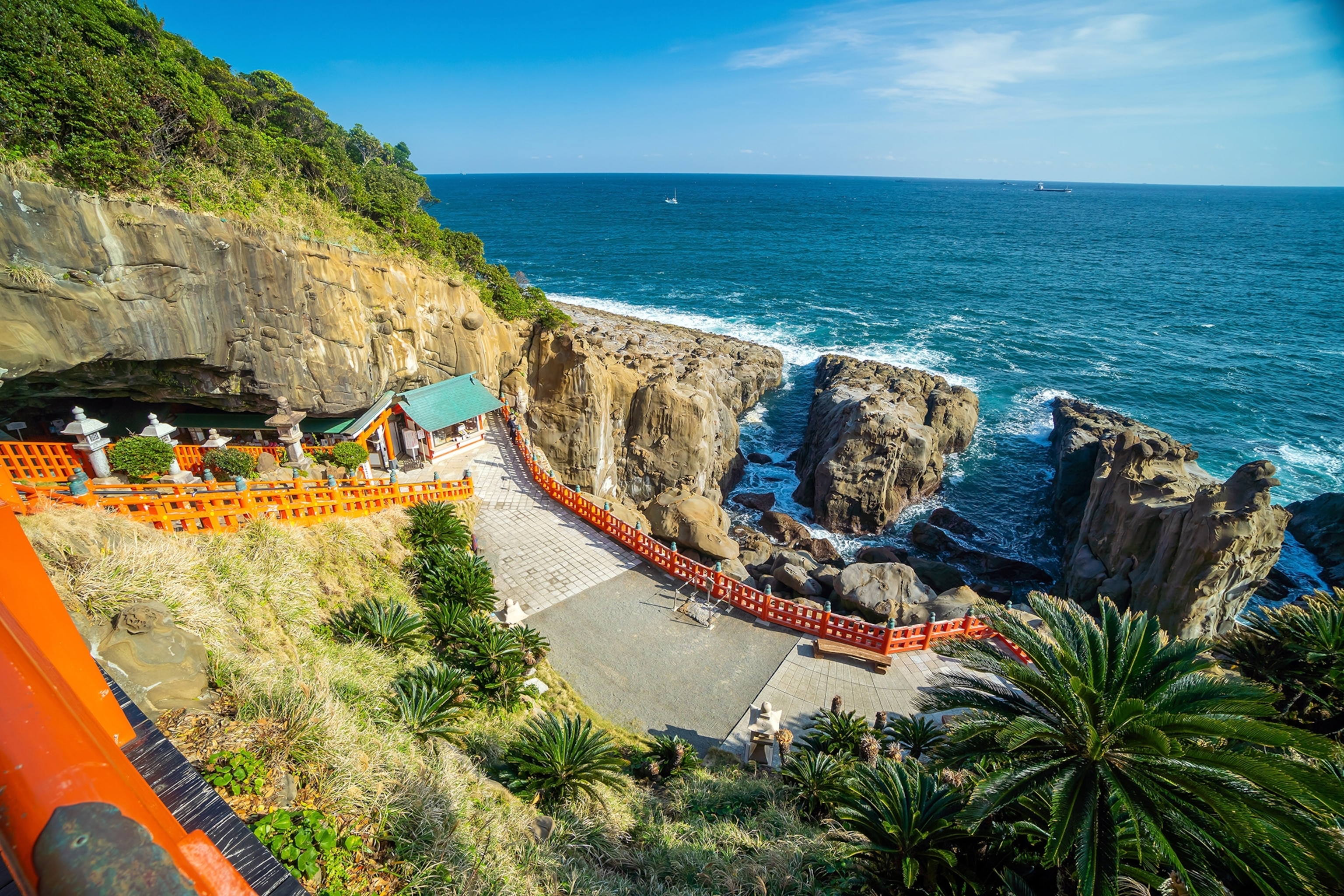 A path lined with tori gates overlooking the ocean