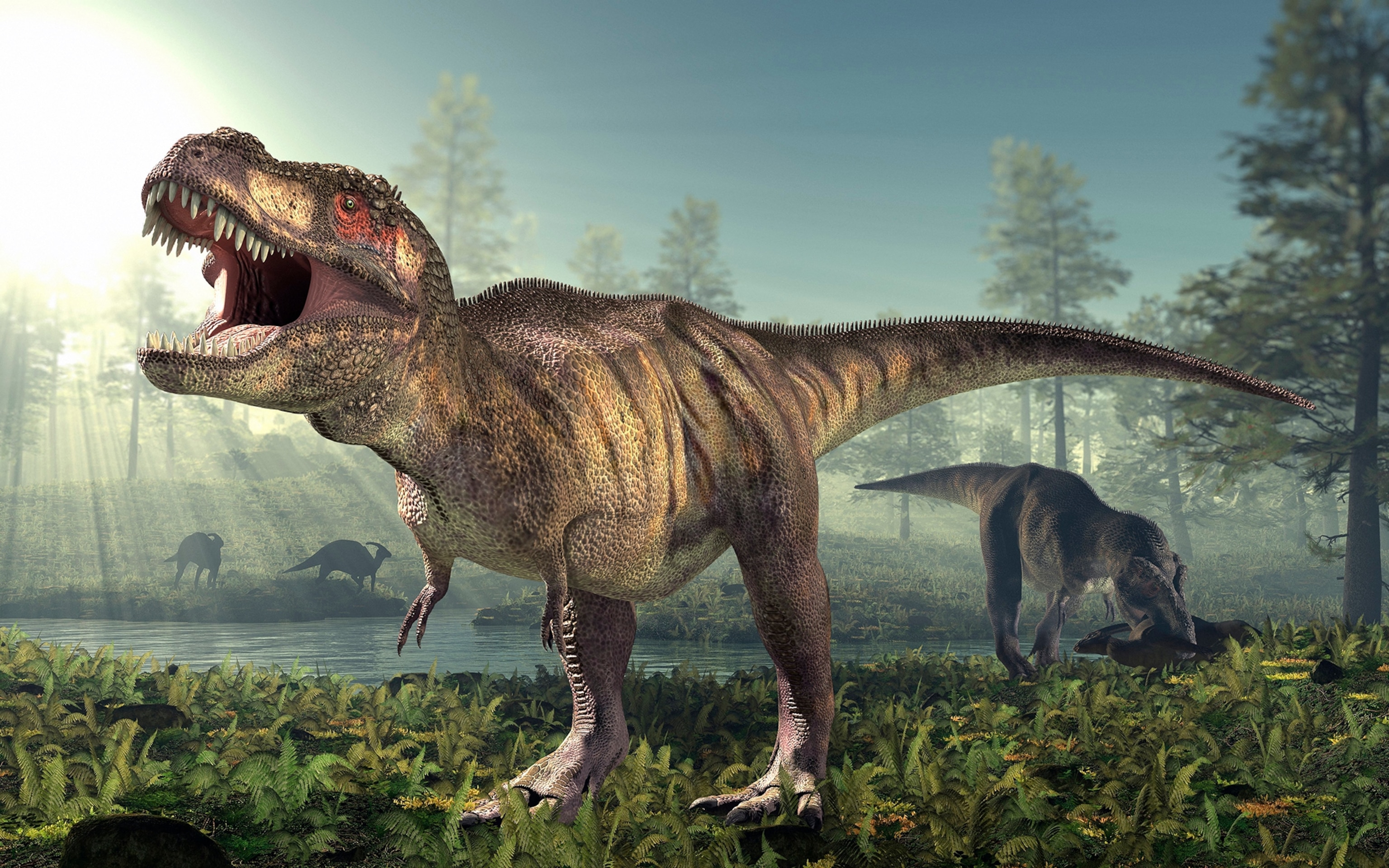 A large Tyrannosaurus rex stands near a forest pond with its mouth open, while another dinosaur feeds on a carcass in the background and smaller dinosaurs gather near the water's edge.