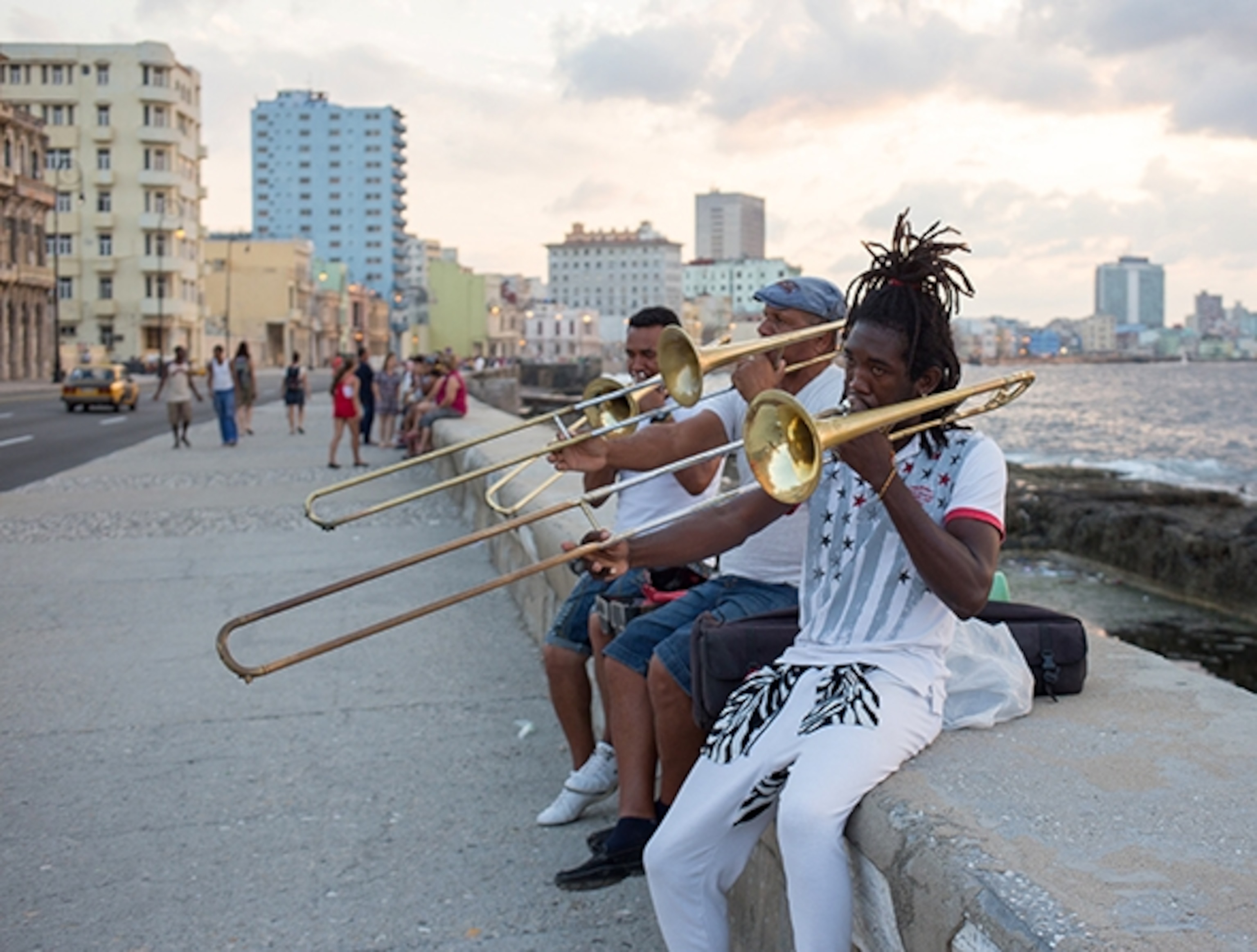 Musicians play on Havana's old stone wall of the Malecón. (Photograph by Erika Skogg)
