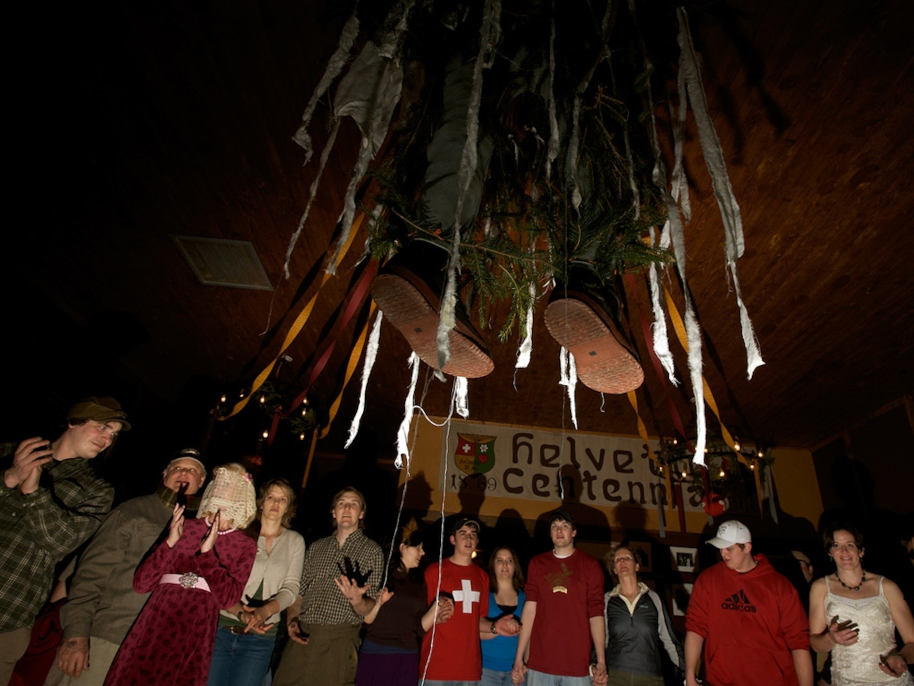 A circle of people around a hanging effigy