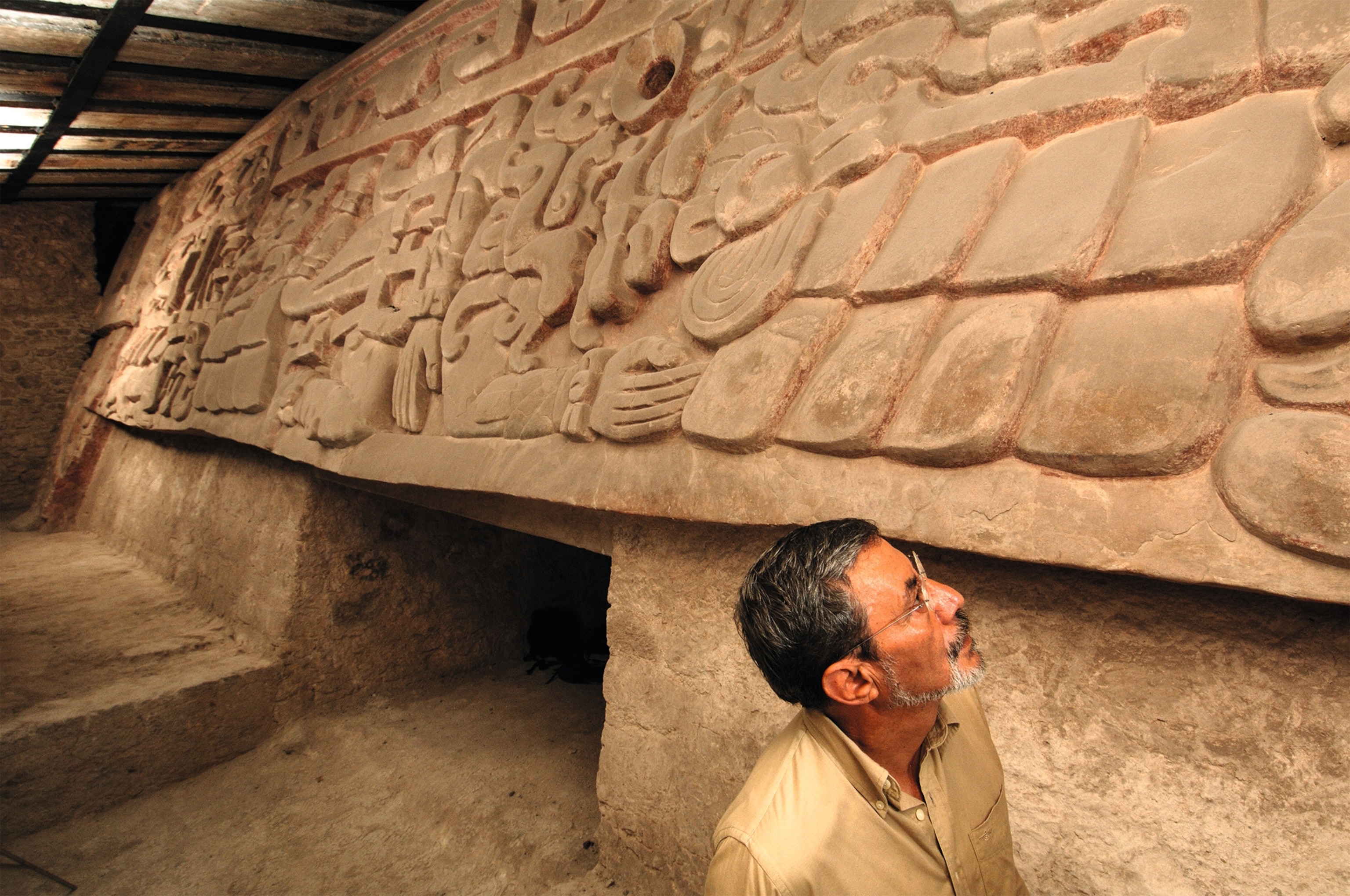 Vargas looks at the frieze on Structure II.