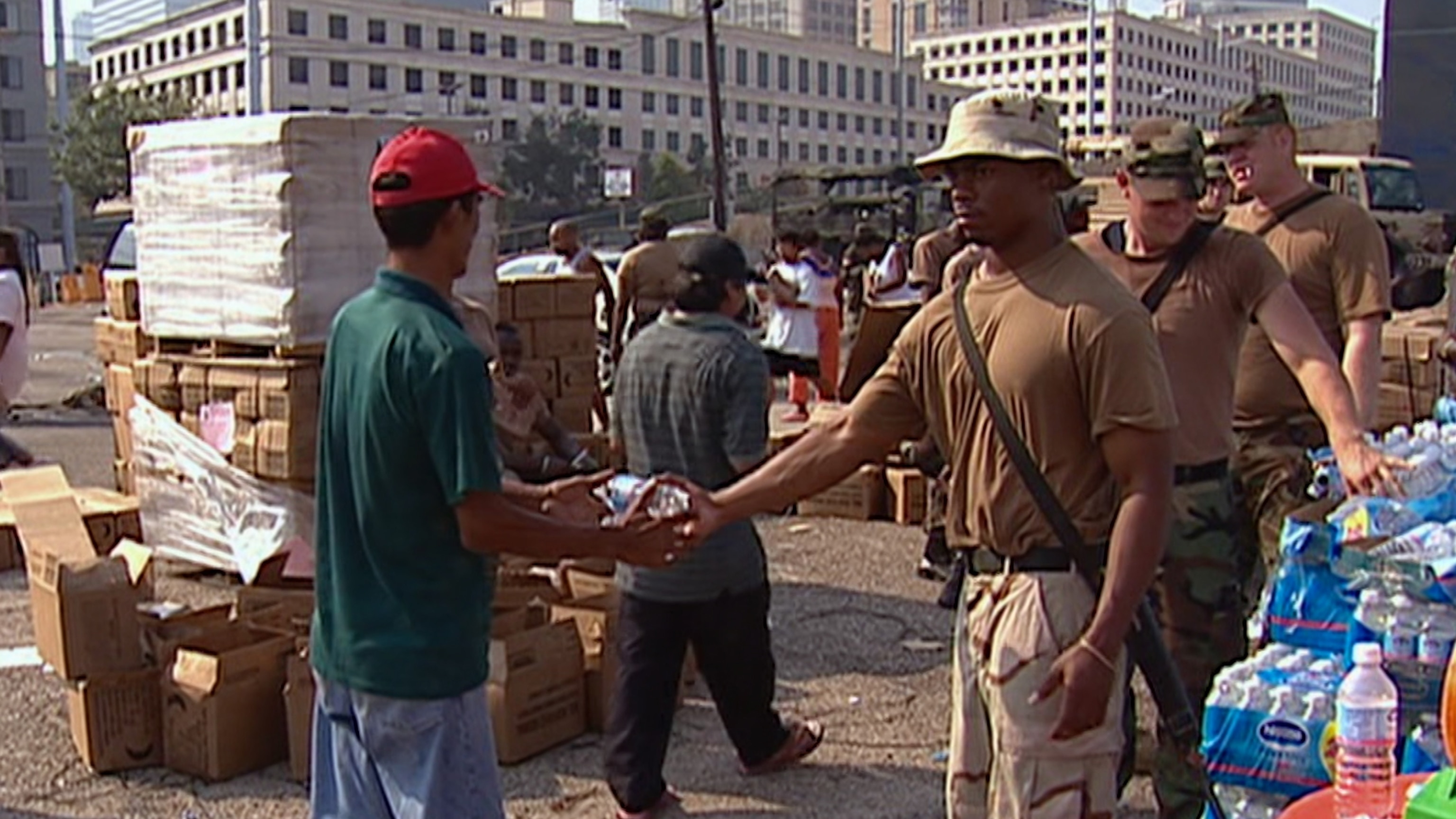 Members of the National Guard distribute water to New Orleans residents following Hurricane Katrina in 2005.