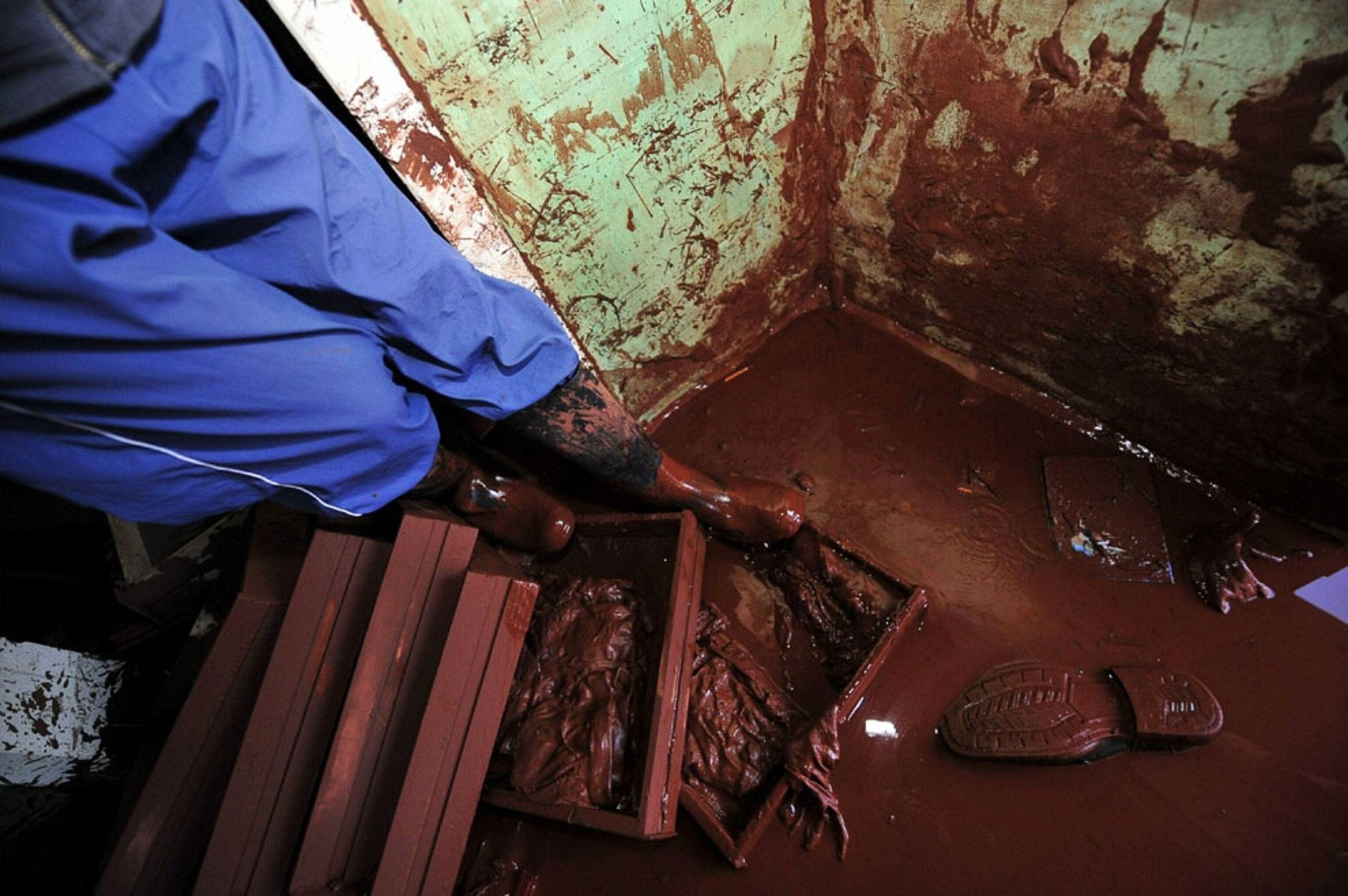 the interior of a Hungary home, flooded with red toxic sludge.