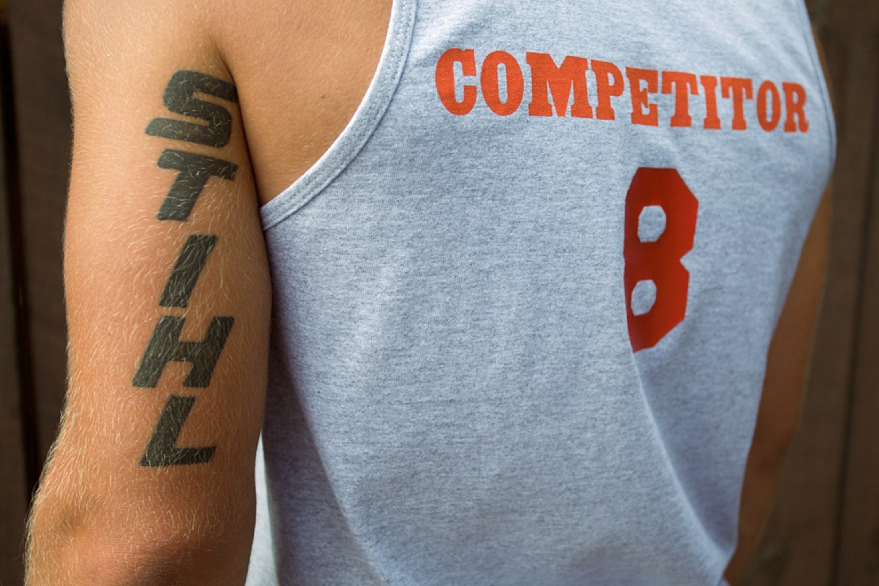 Man's arm with Stihl tattoo