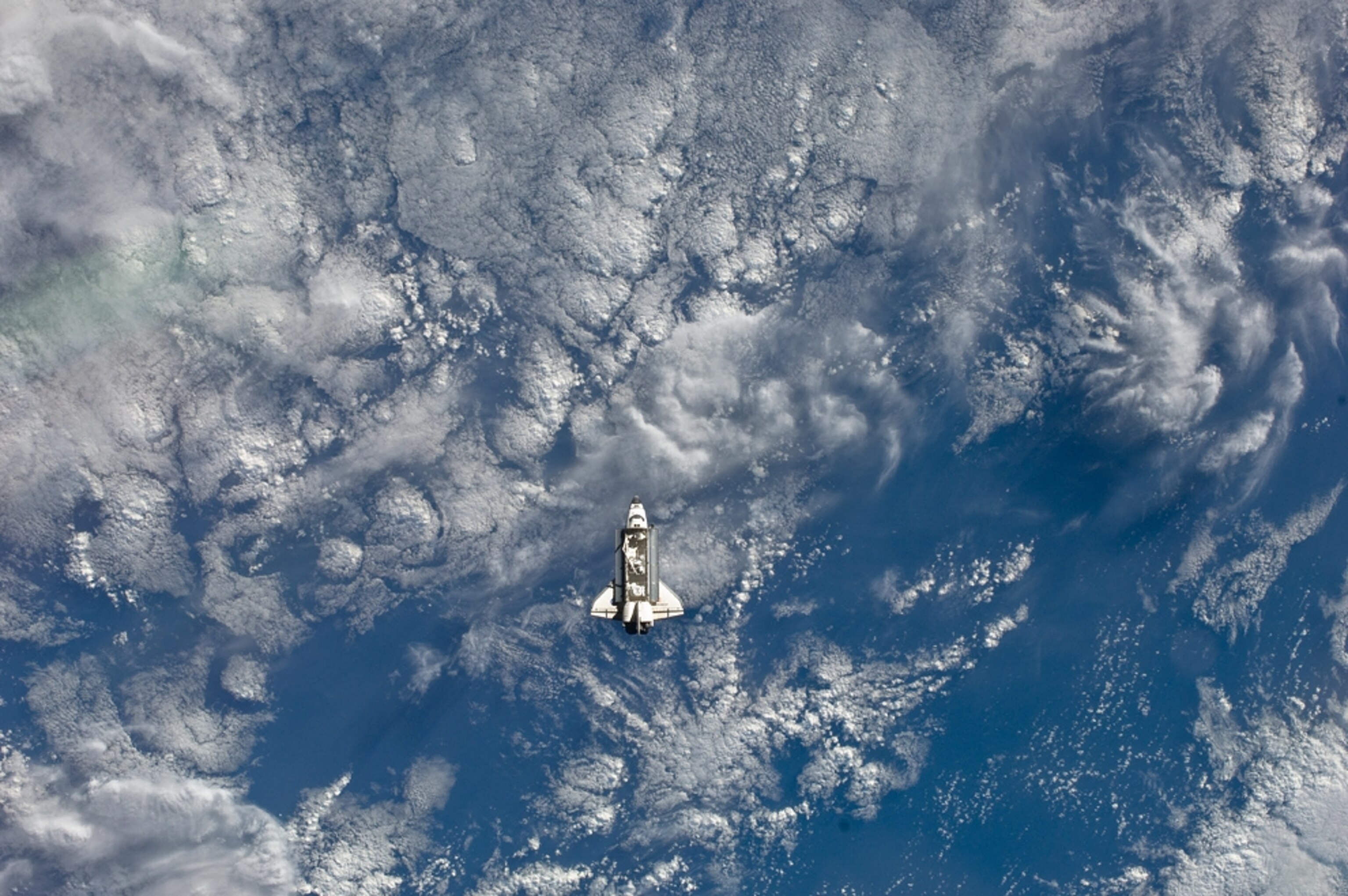 A photograph of the space shuttle Endeavour approaching the International Space Station.
