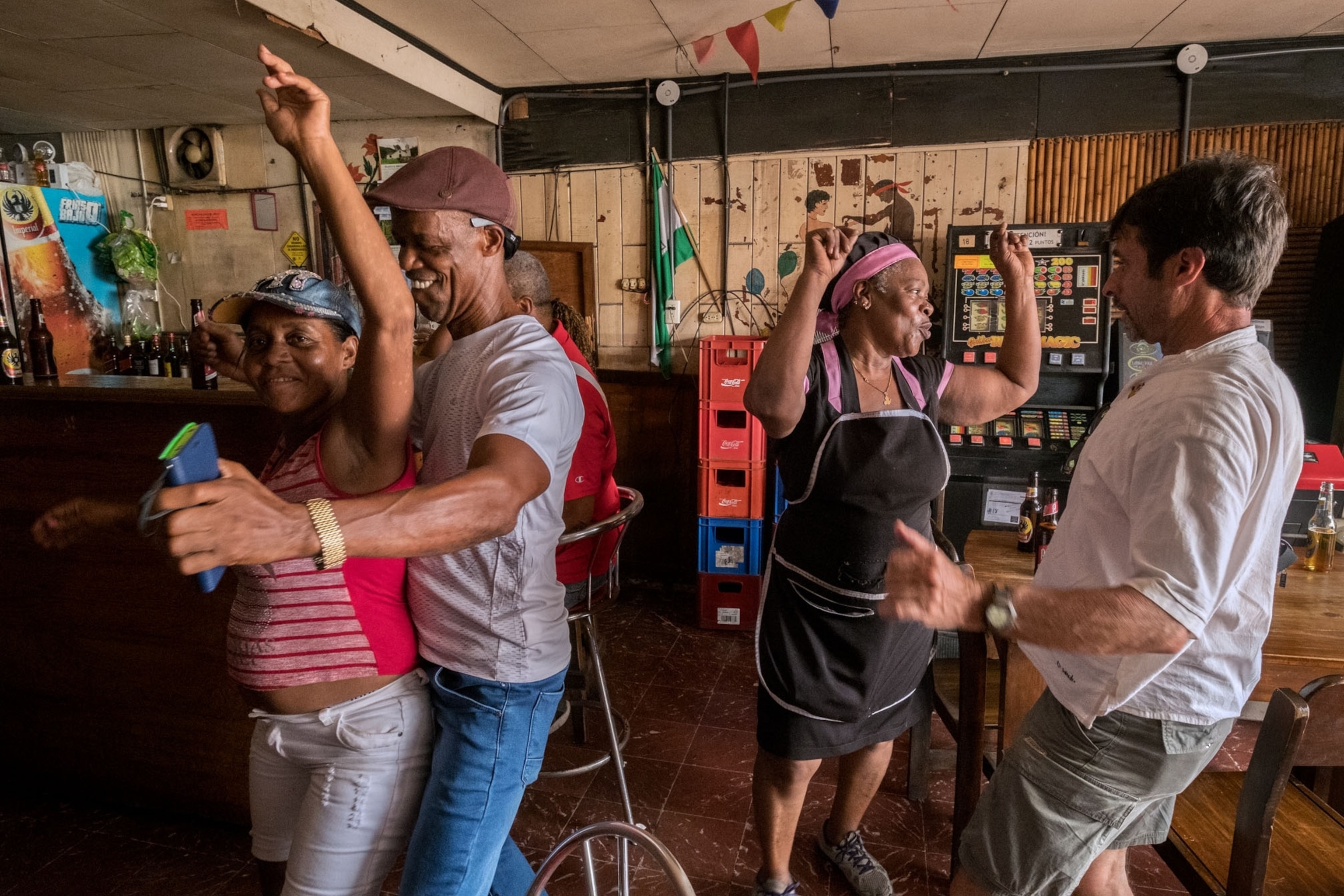 people taking spontaneous midday break to dance to pulsating music in a bar, Costa Rica.