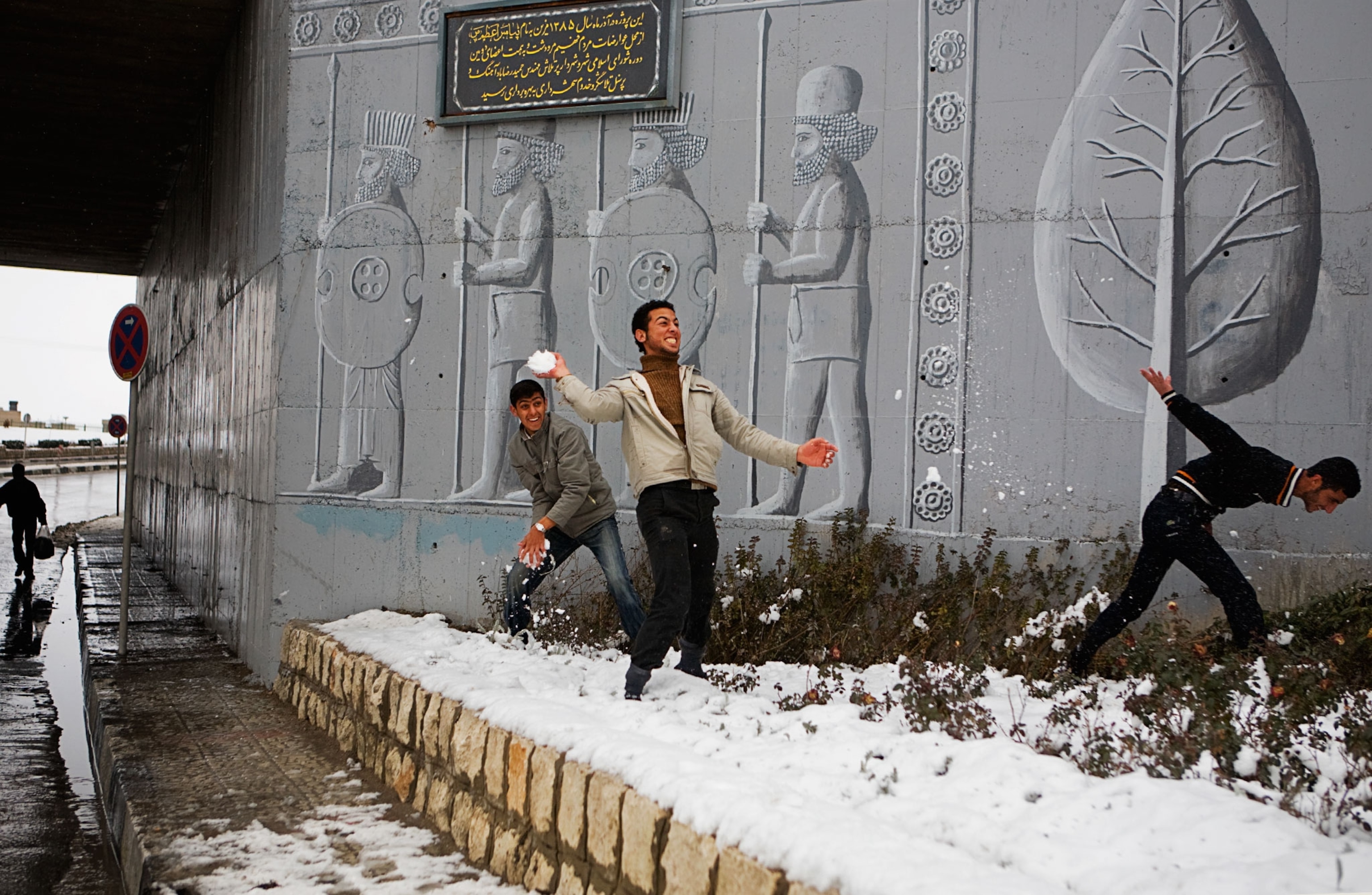 Iranian youth having a snowball fight