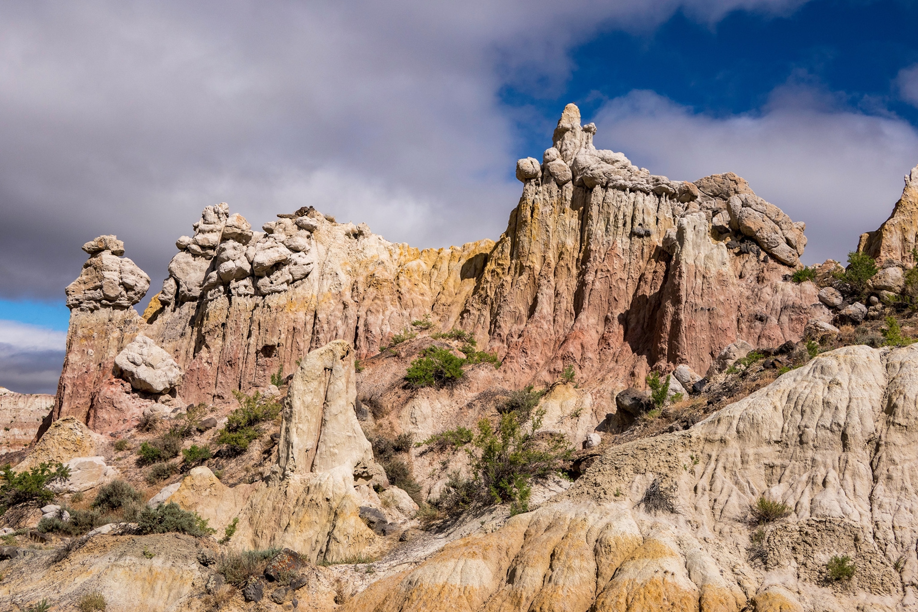 Unique rock formations rise against a blue sky