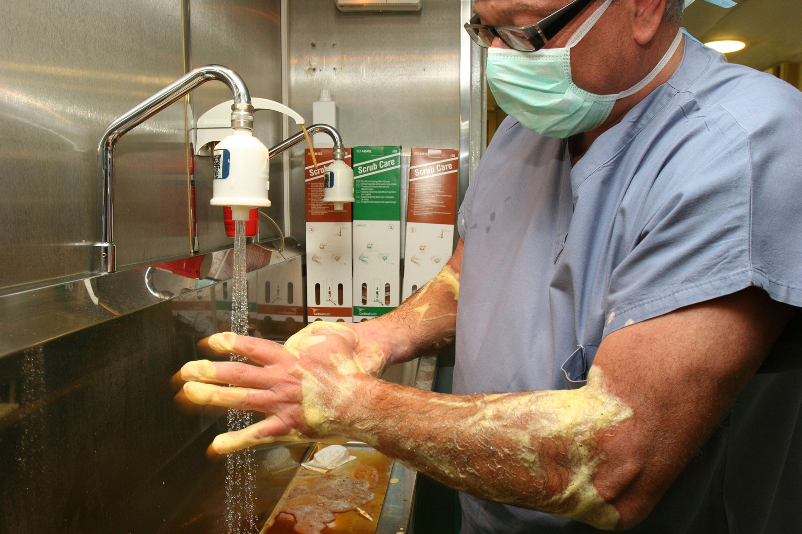 a doctor washing his hands before surgery