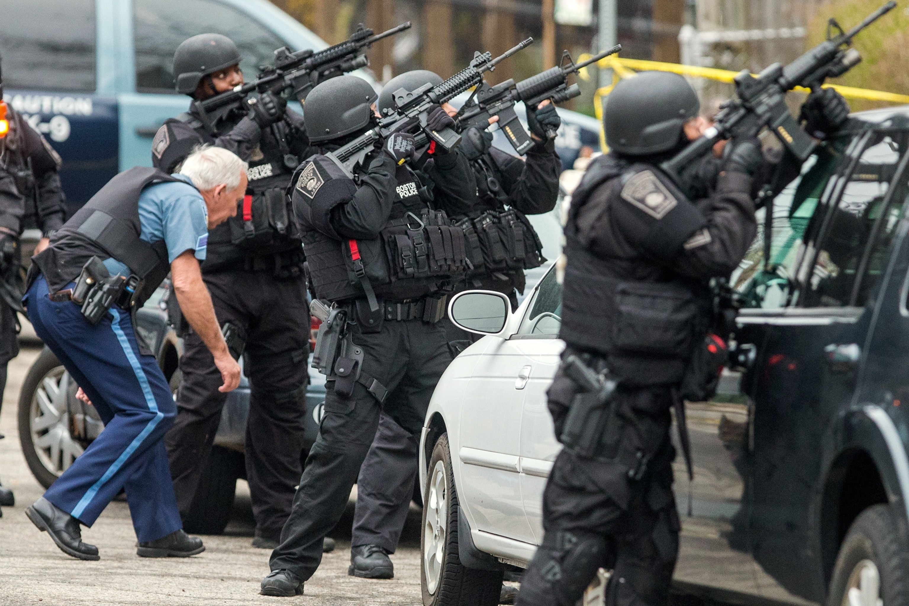 This Week in Boston - SWAT team members draw their weapons while searching for the Boston Marathon bombing suspects.