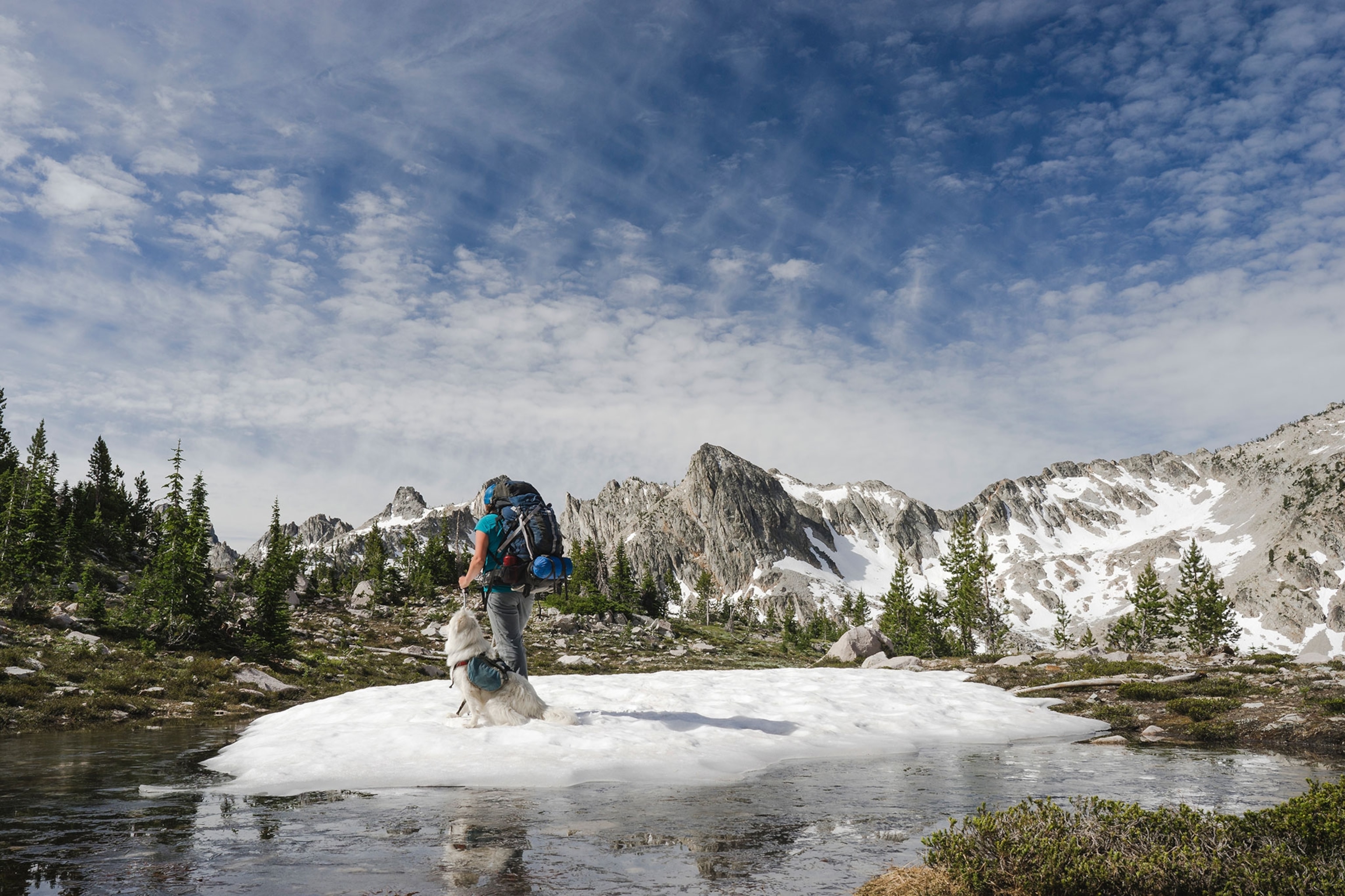 a backpacker with a dog in the Sawtooth Mountains, Idaho