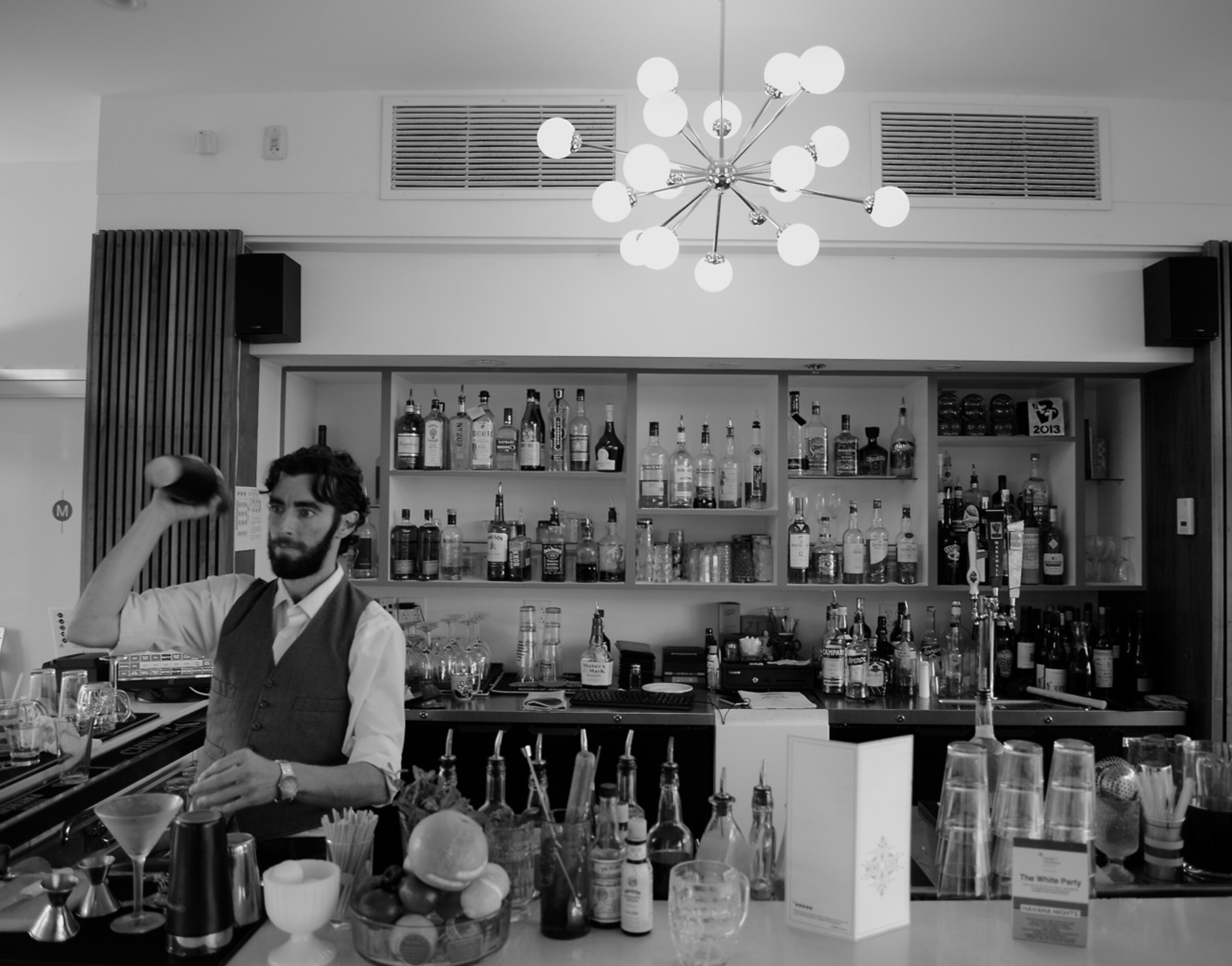 A bartender shakes up a cocktail at The Vault, an old bank-turned restaurant in Tulsa, Oklahoma. (Photo by Andrew Evans, National Geographic Travel)