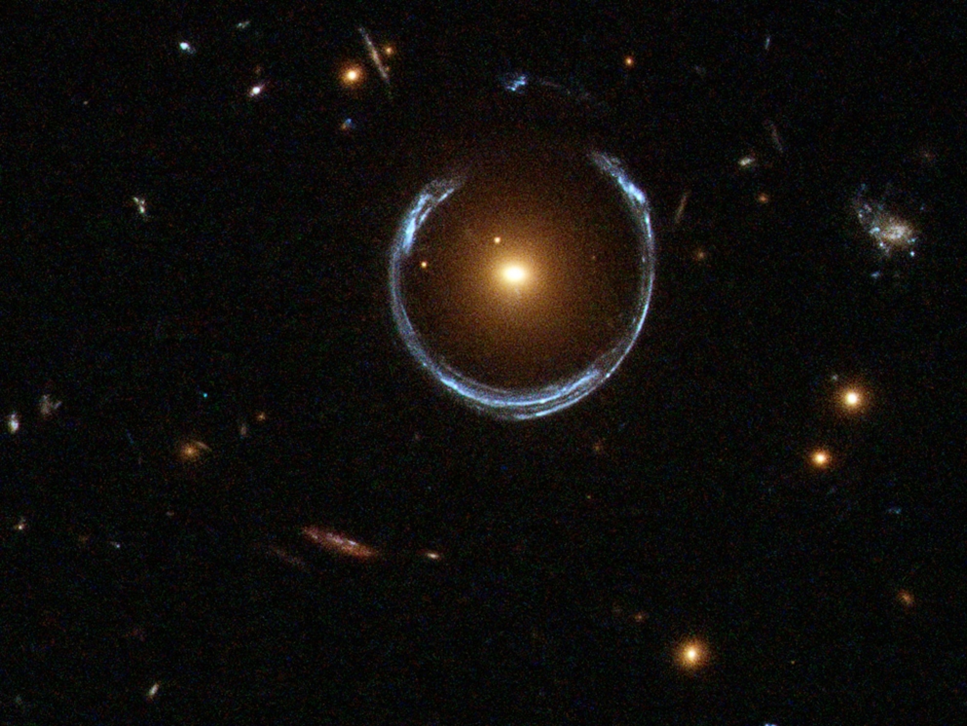Galaxy picture: horseshoe ring around a red galaxy