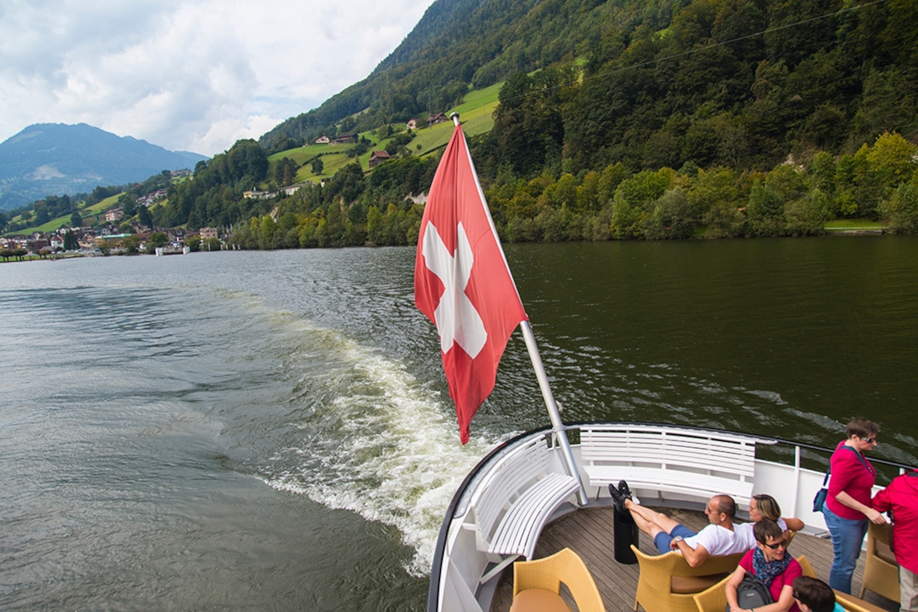 a boat flying the Swiss flag on Lake Lucerne, Switzerland