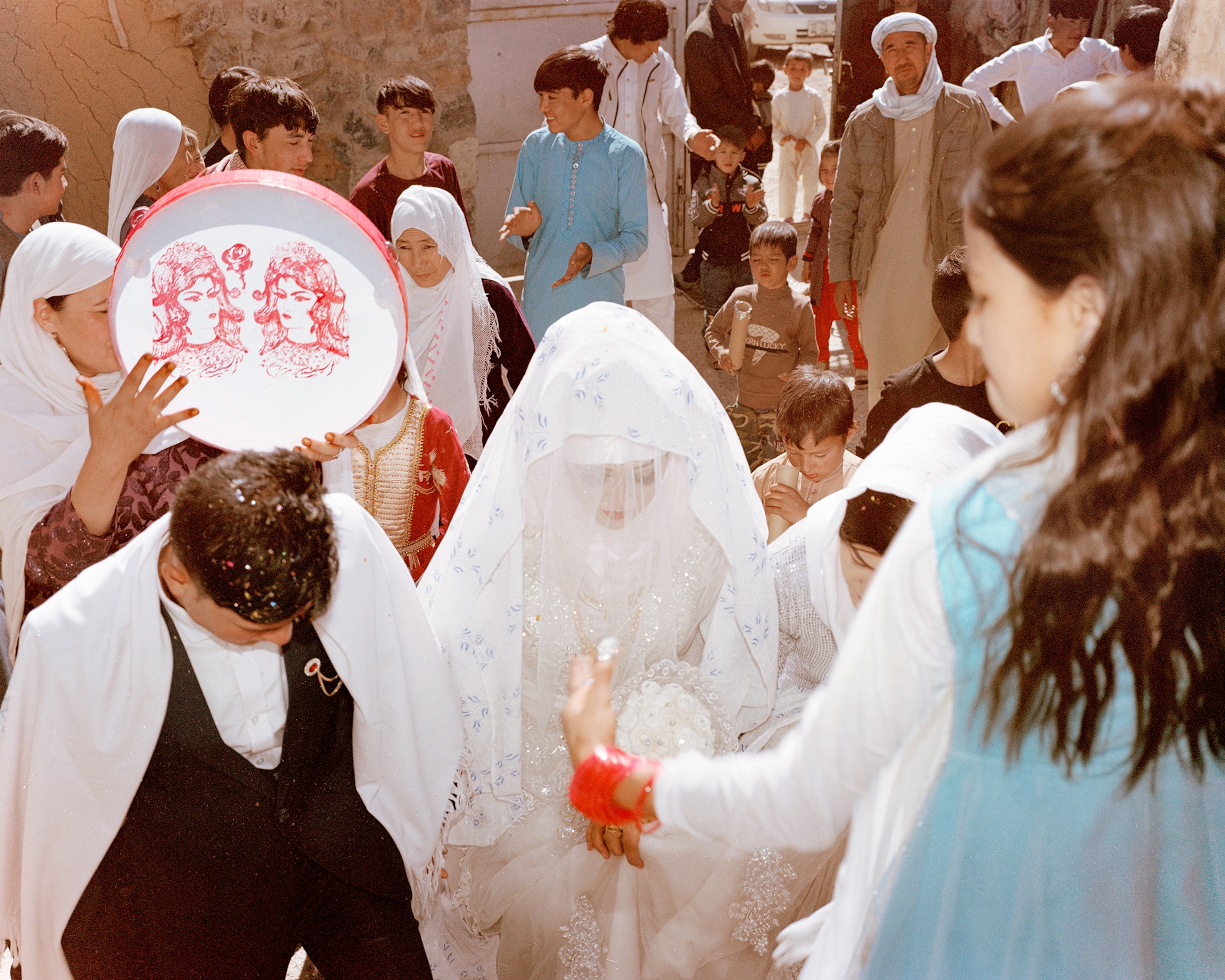 In the Bamyan province, Shakeri witnessed the union of a young couple. For a wedding, the environment was deeply tense. These kinds of celebratory gatherings can easily draw the ire of the Taliban, who disapprove of music and dance. Taliban police conduct raids at public and private events to impose bans on music and revelry; there have been reports of Taliban forces crashing weddings, detaining the groom and the guests, and at times even firing upon the wedding party. As a result, these celebrations—formerly grand affairs in Afghan communities—are now often held in privat