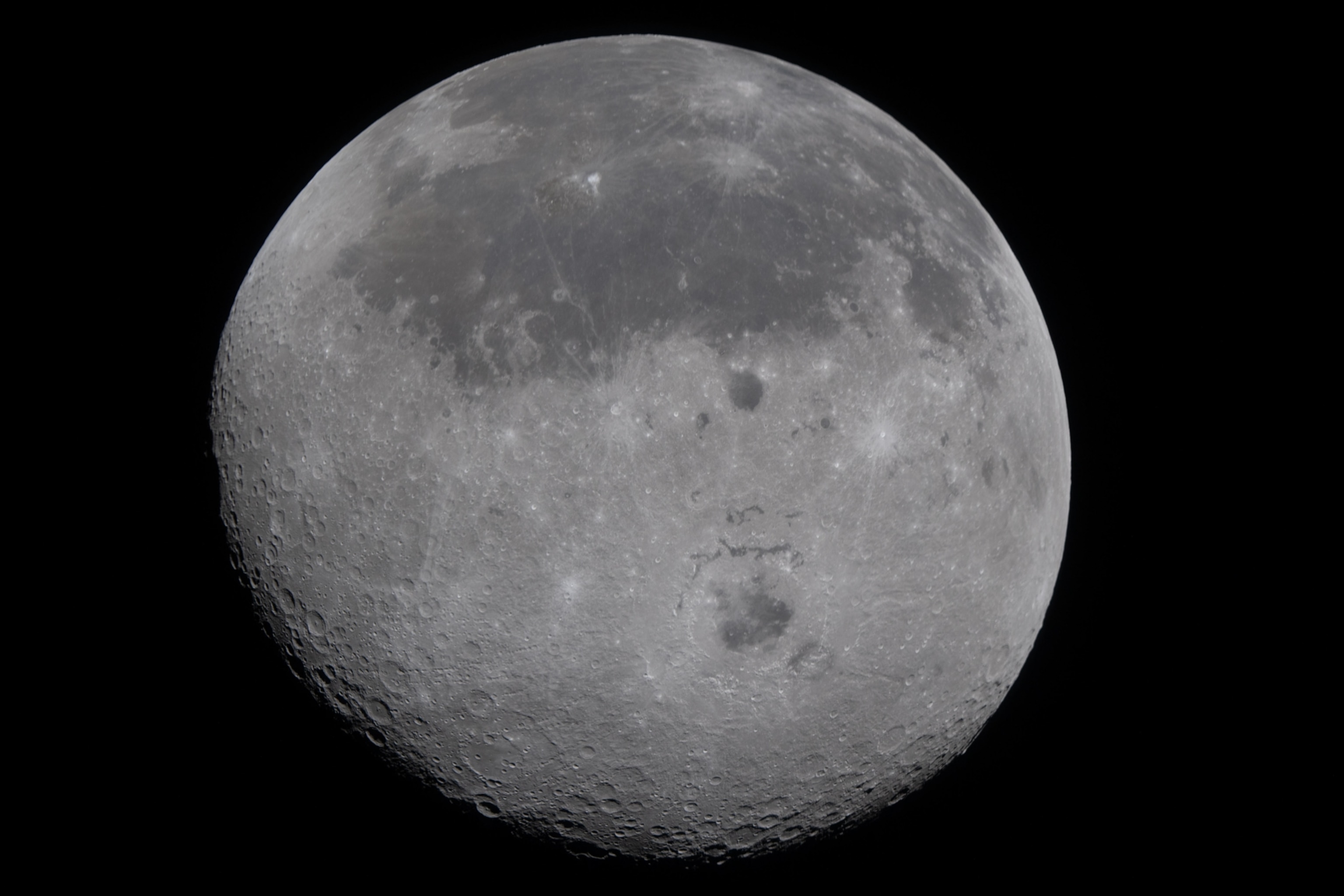 A detailed, full moon with prominent craters