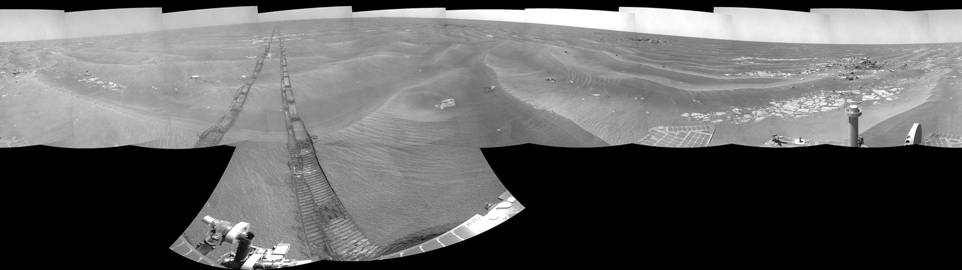 NASA's Mars Exploration Rover Opportunity captured this view of "Burns Cliff" after driving right to the base of this southeastern portion of the inner wall of "Endurance Crater." The view combines frames taken by Opportunity's panoramic camera between the rover's 287th and 294th martian days (Nov. 13 to 20, 2004).