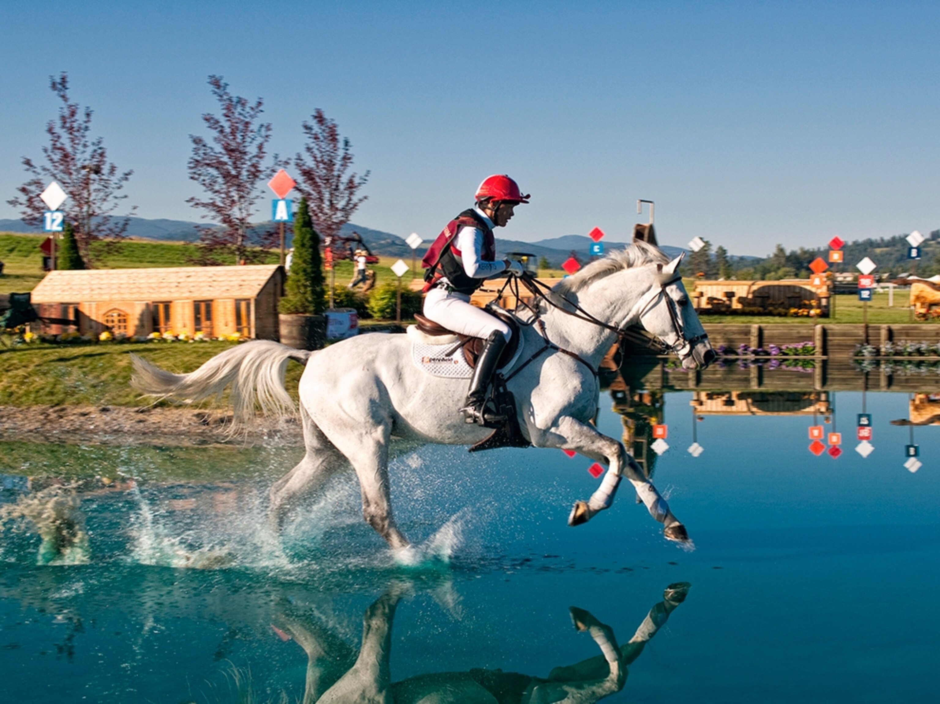 an equestrian participating in a cross-country event during The Event at Rebecca Farms, Kalispell, Montana