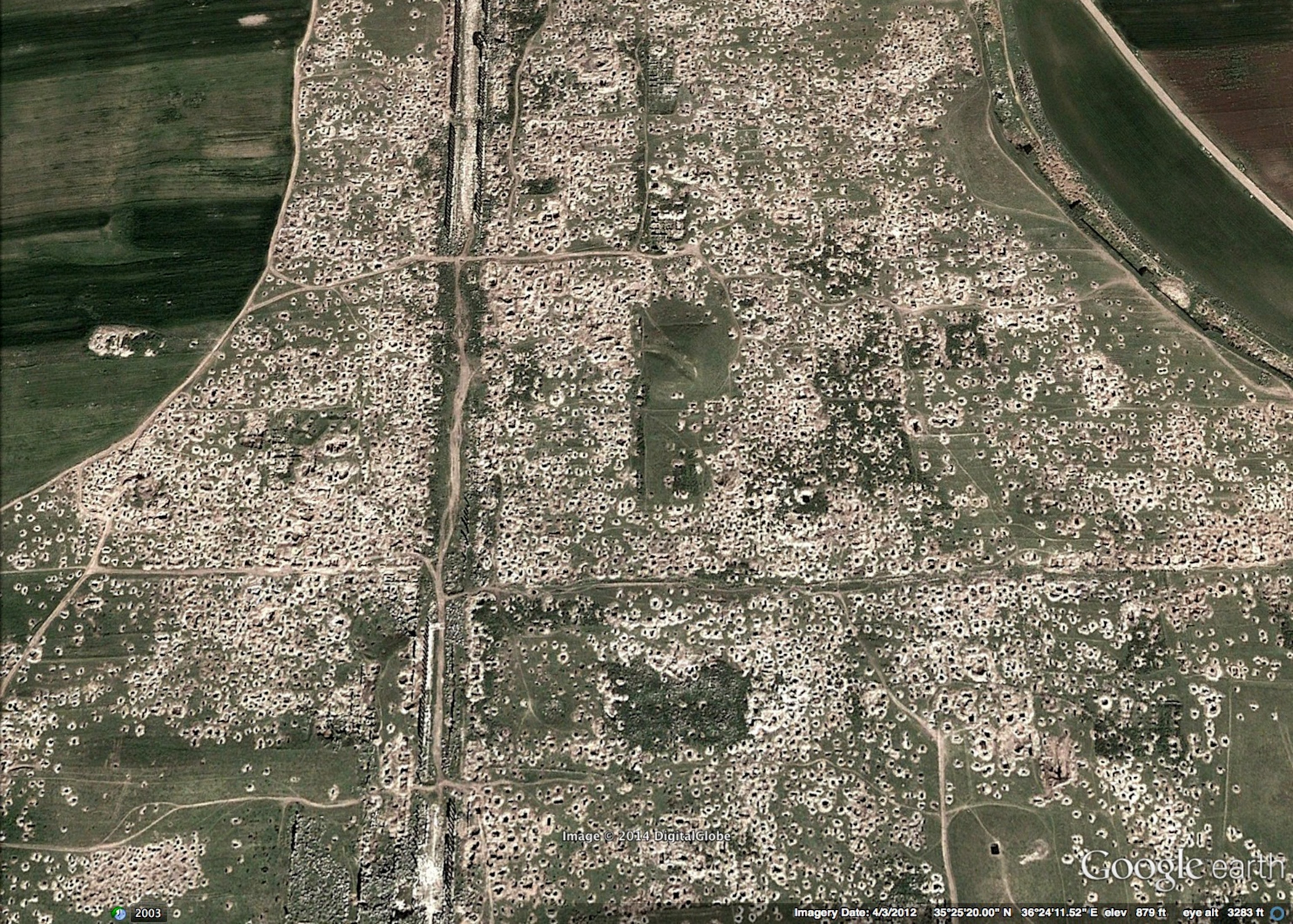 A picture taken on March 14, 2014 shows a Syrian policeman patrolling the ancient oasis city of Palmyra, 215 kilometres northeast of Damascus.