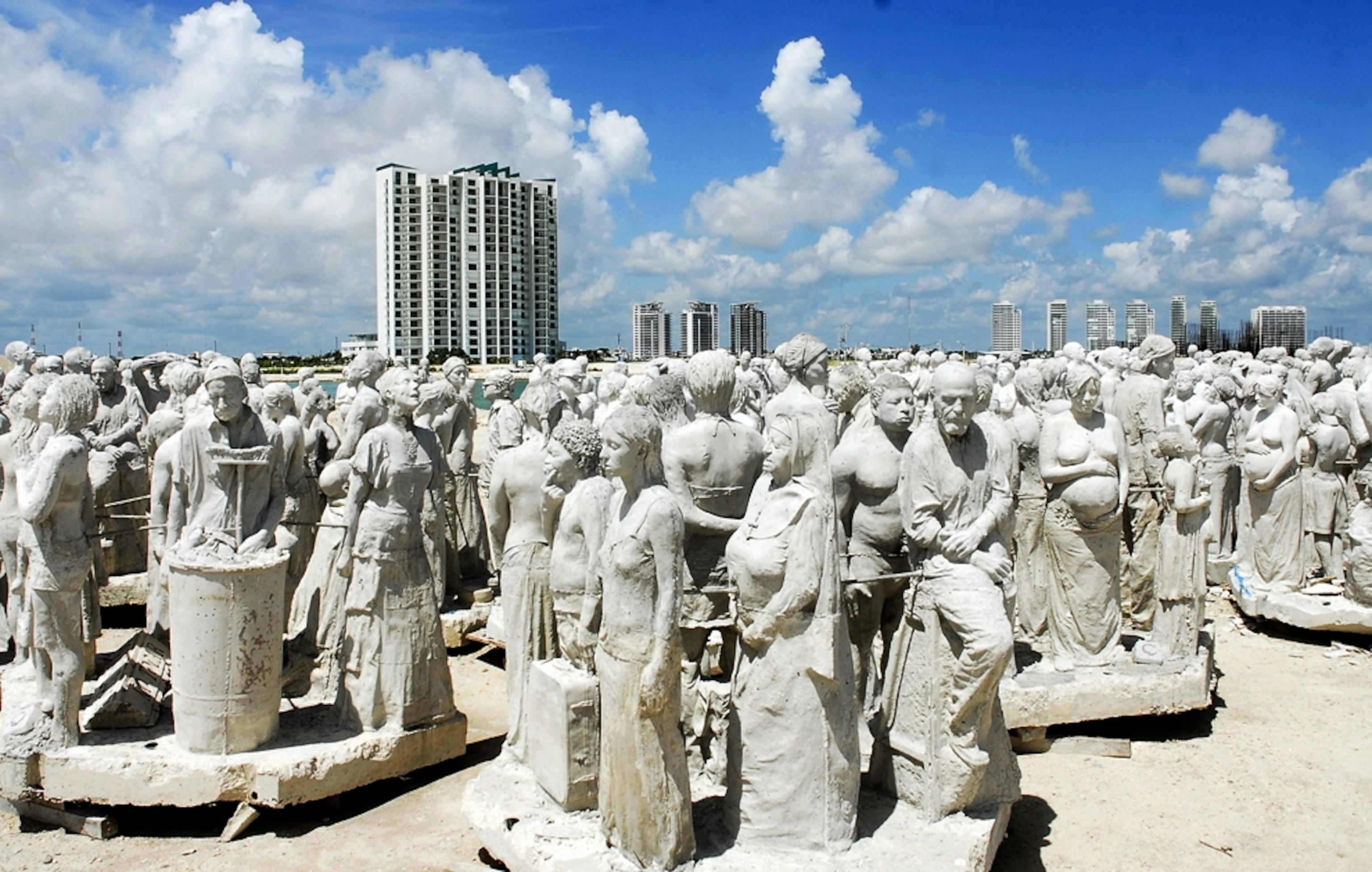 Statues on Cancún beach -- picture from photo gallery on "The Silent Evolution" Caribbean underwater sculpture park off Cancun, Mexico