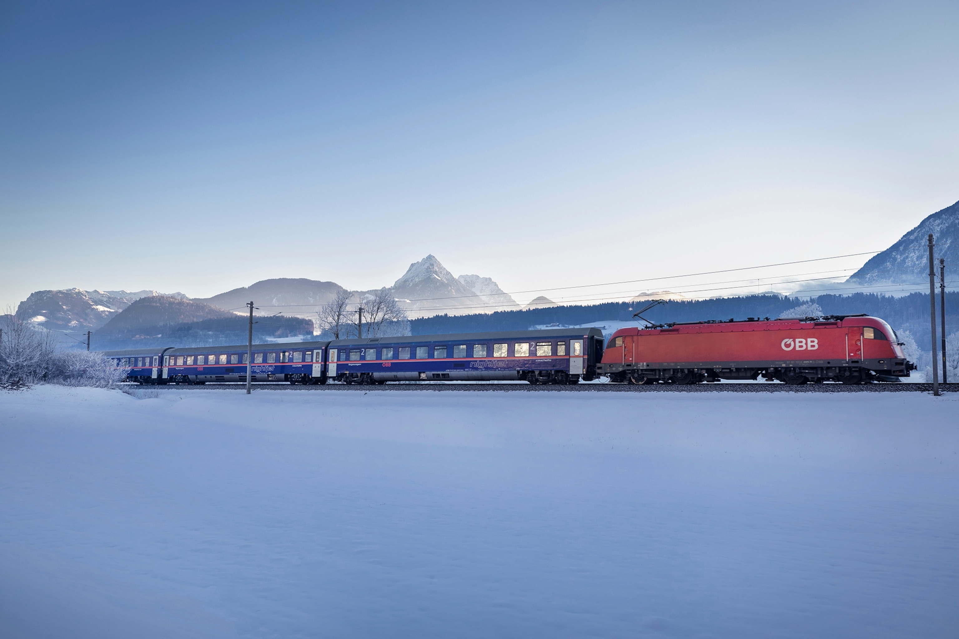 a sleeper train in a snowy landscape