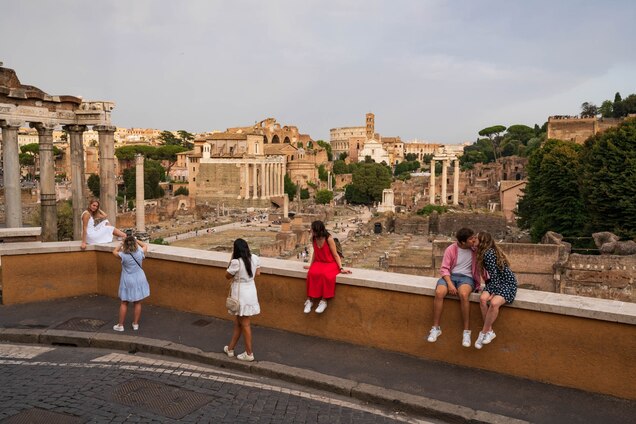 Tourists visit the Roman Forum in Rome, Italy.