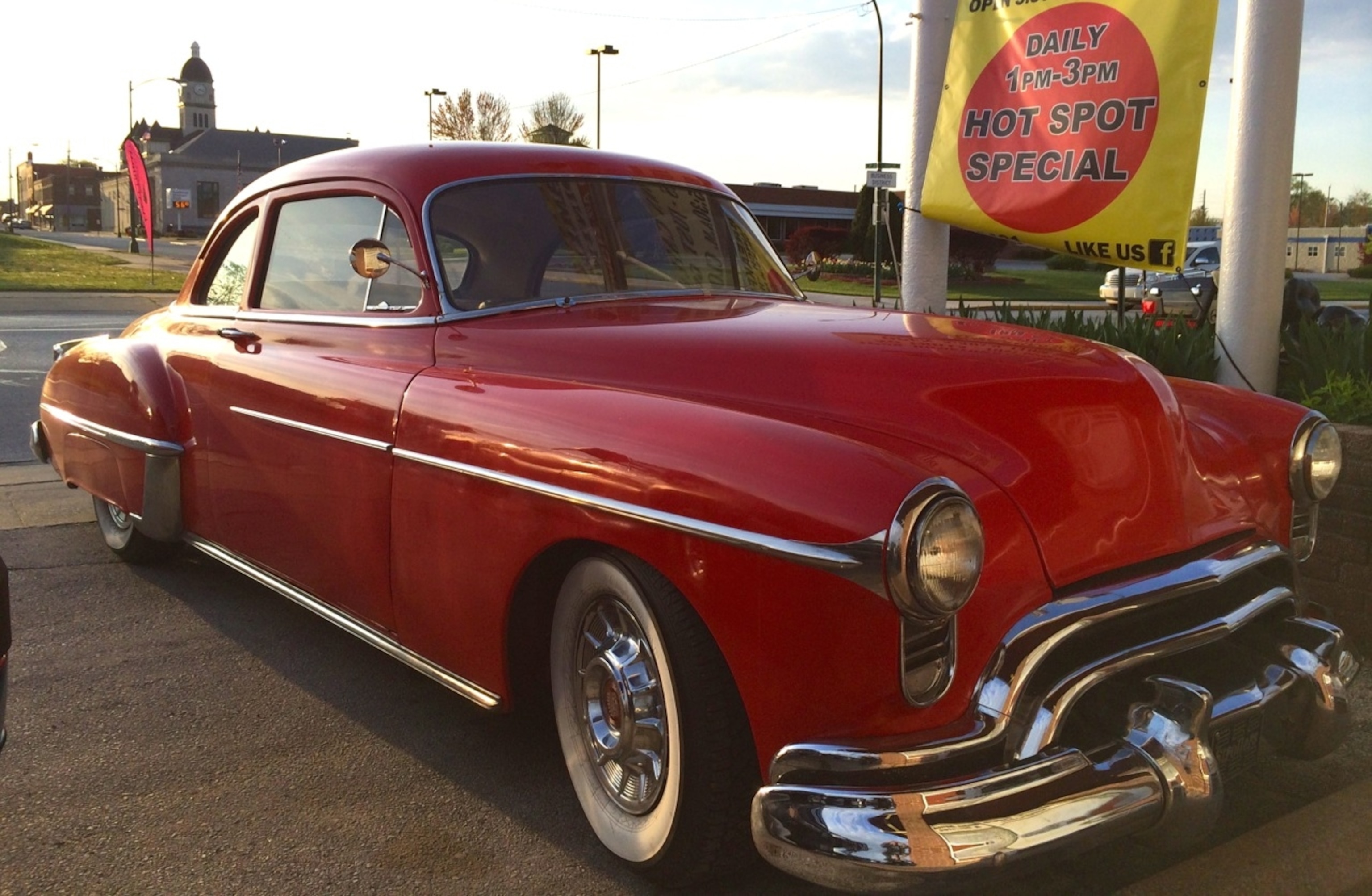 A vintage red car (still in use) offers a bright reminder of Route 66 in Carthage, Missouri. (Photo by Andrew Evans, National Geographic Travel)