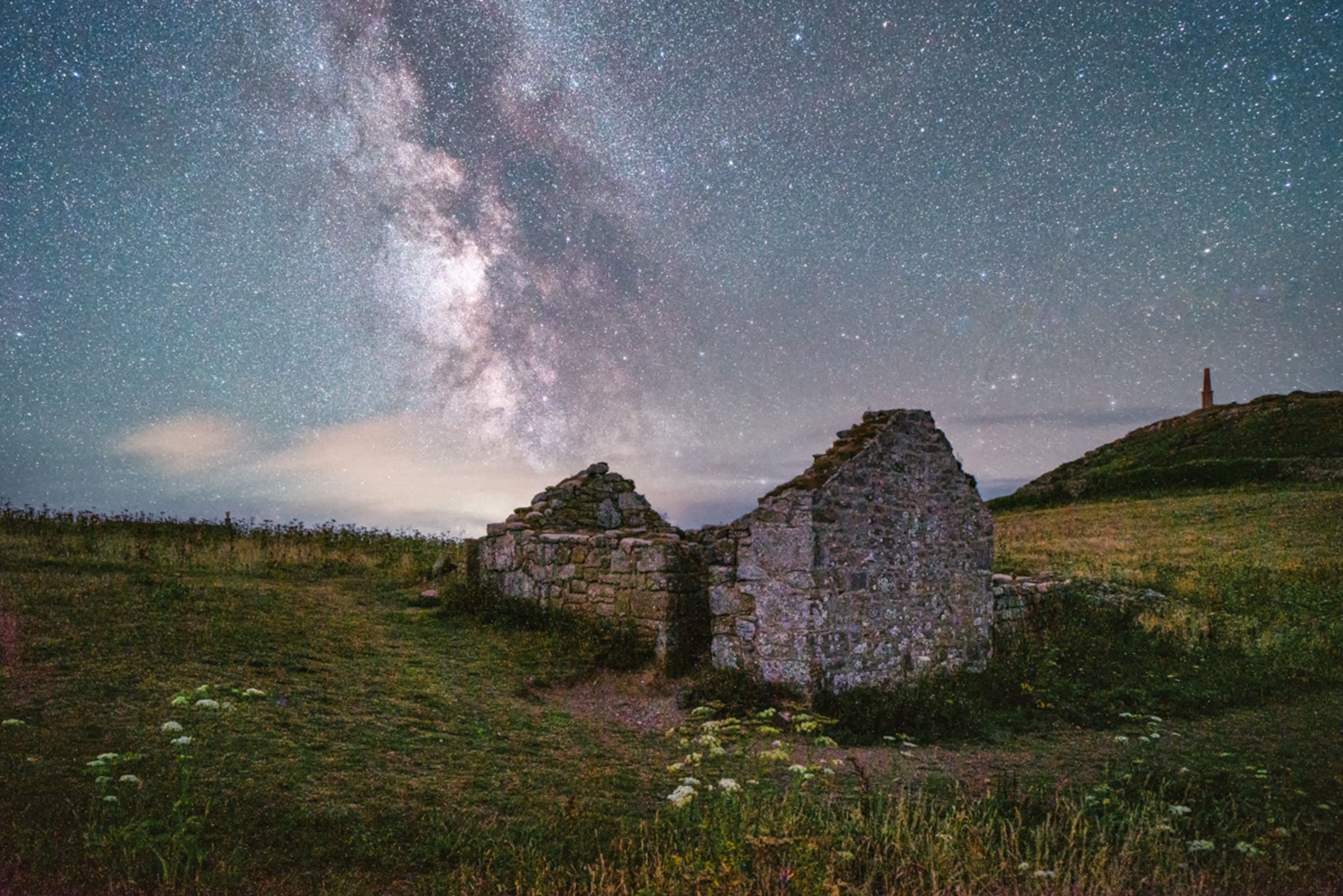An old chapel at Cape Cornwall is seen against the night sky with the Milky Way visible