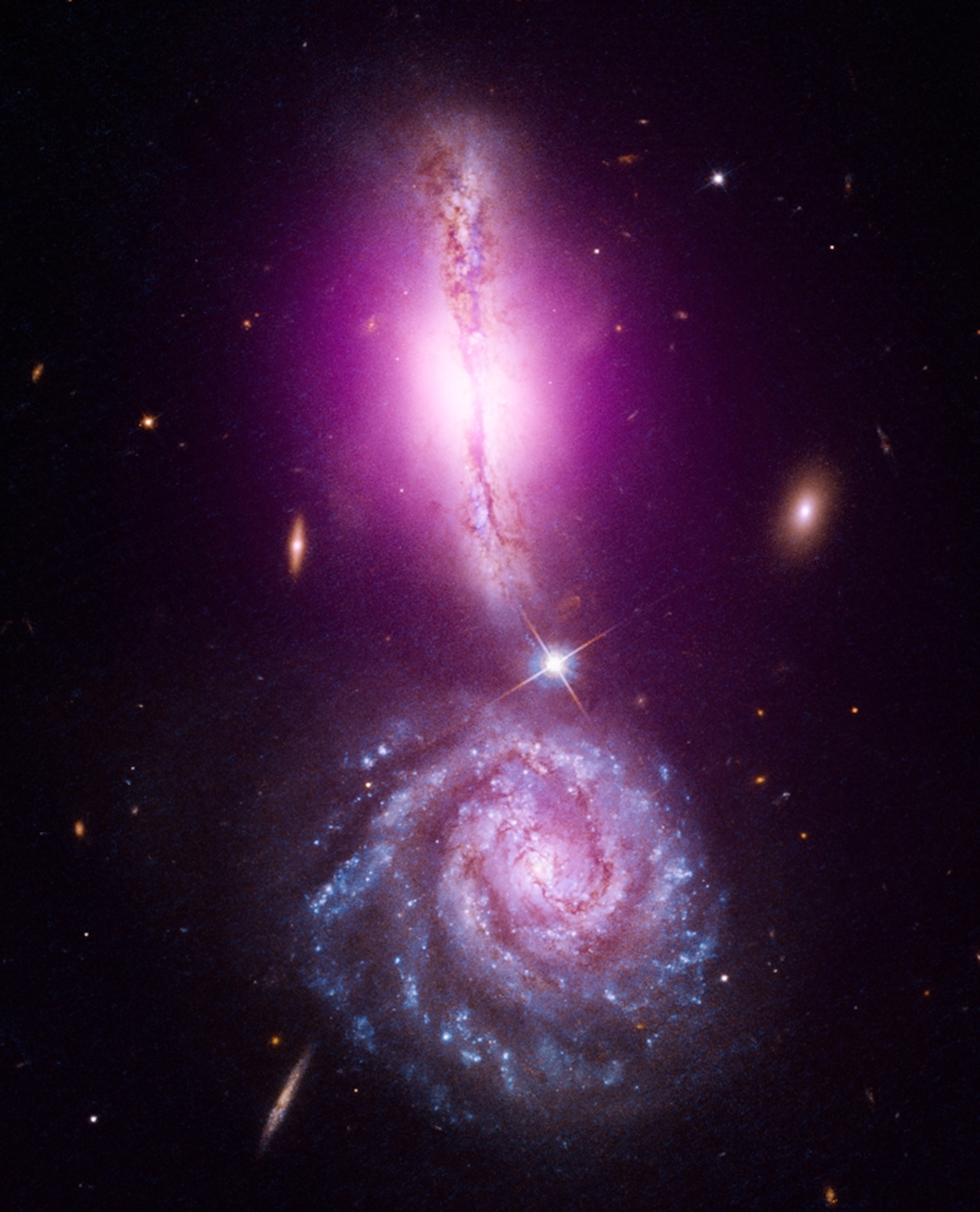 colliding galaxies that look like an exclamation mark