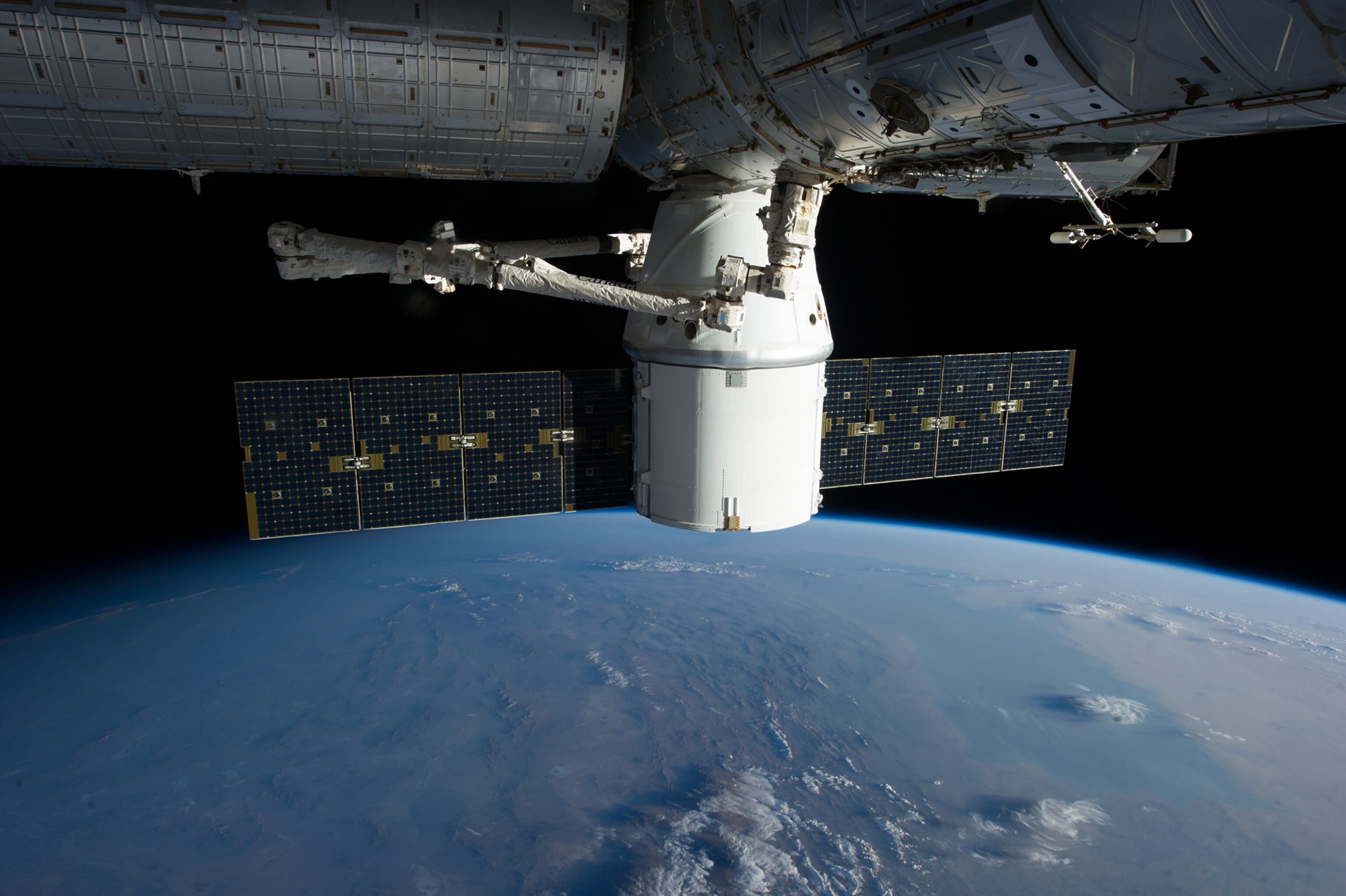 Space Pics - A picture of the SpaceX Dragon docking with the International Space Station