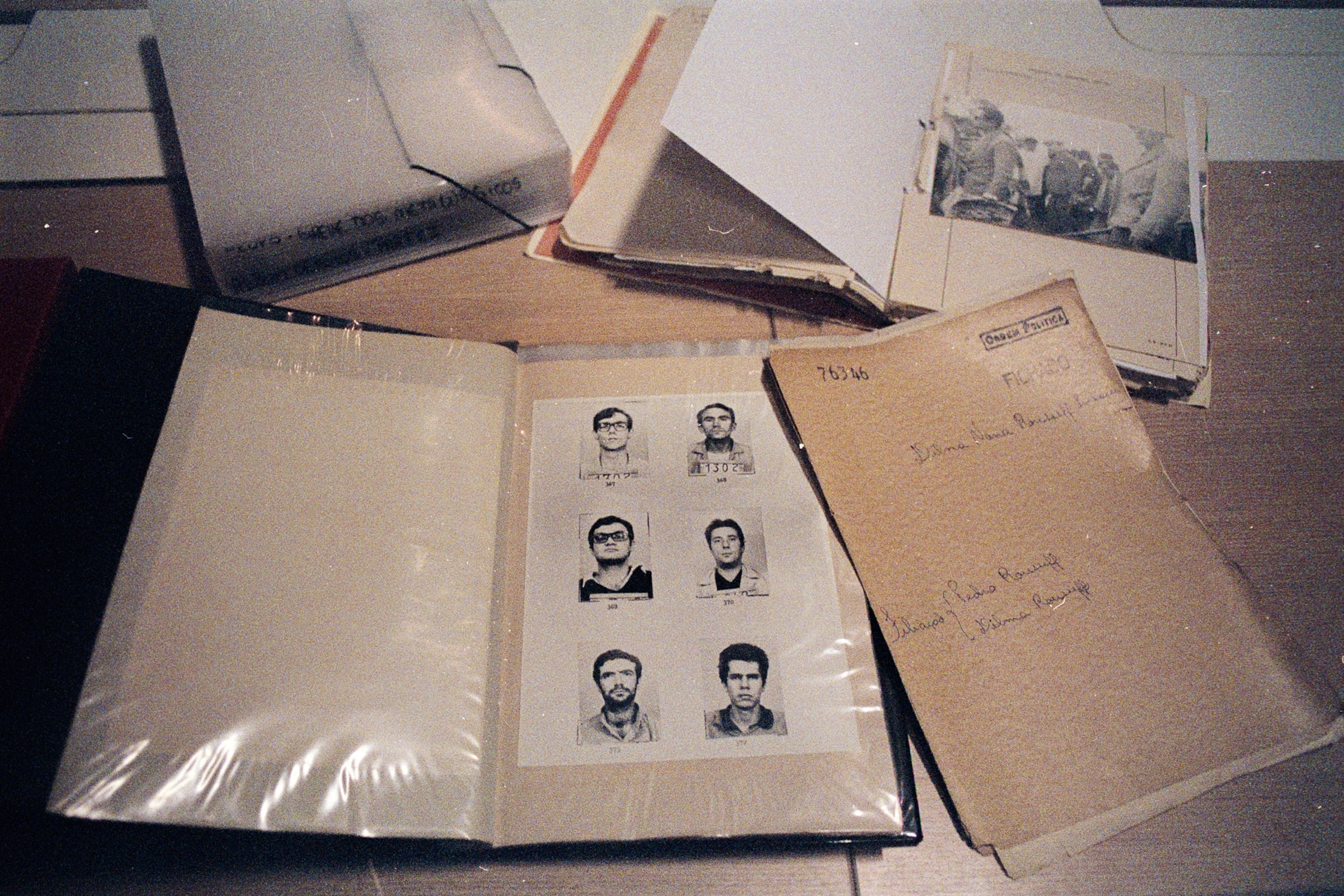 A top view of portraits in a binder.