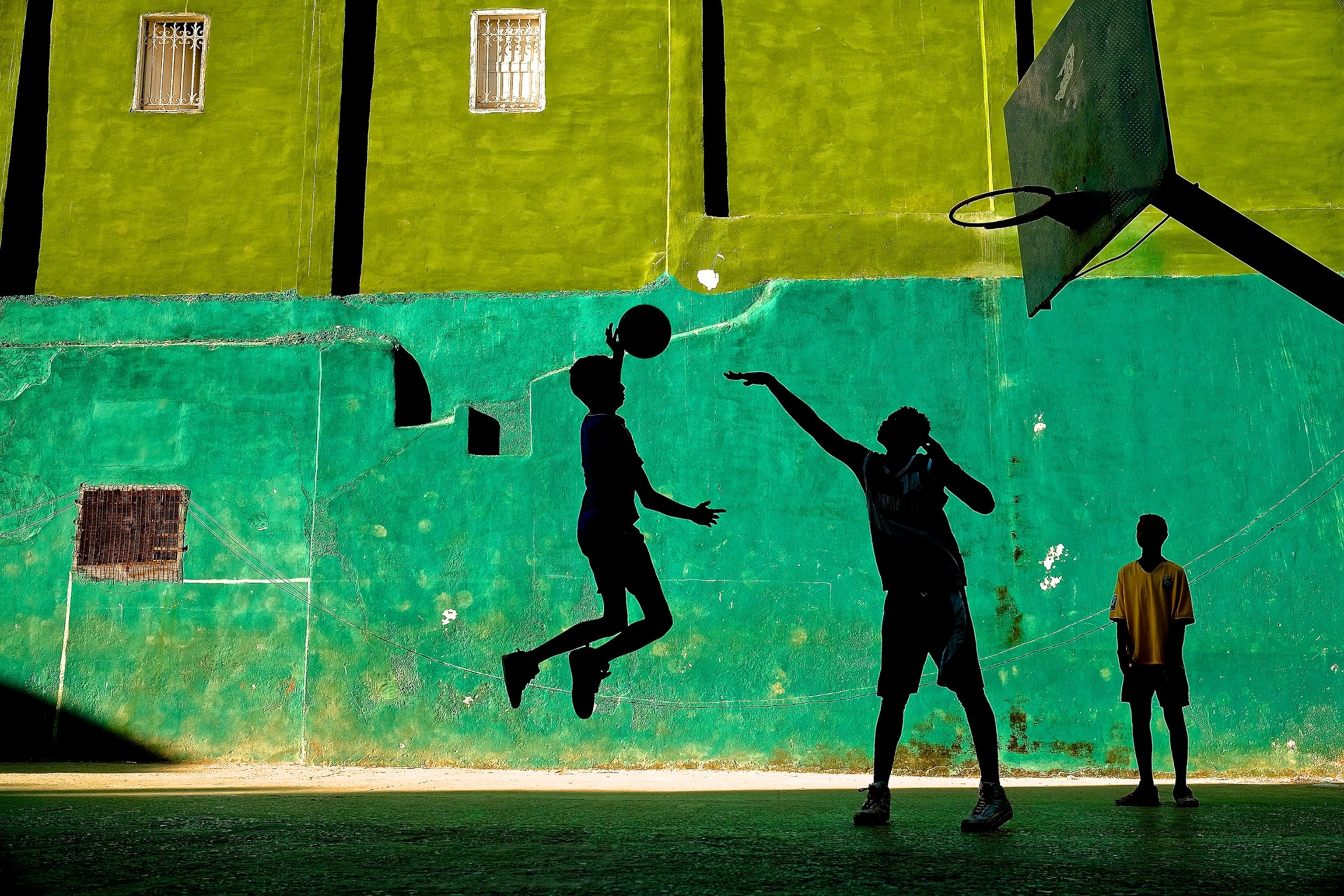 boys playing basketball in Havana, Cuba