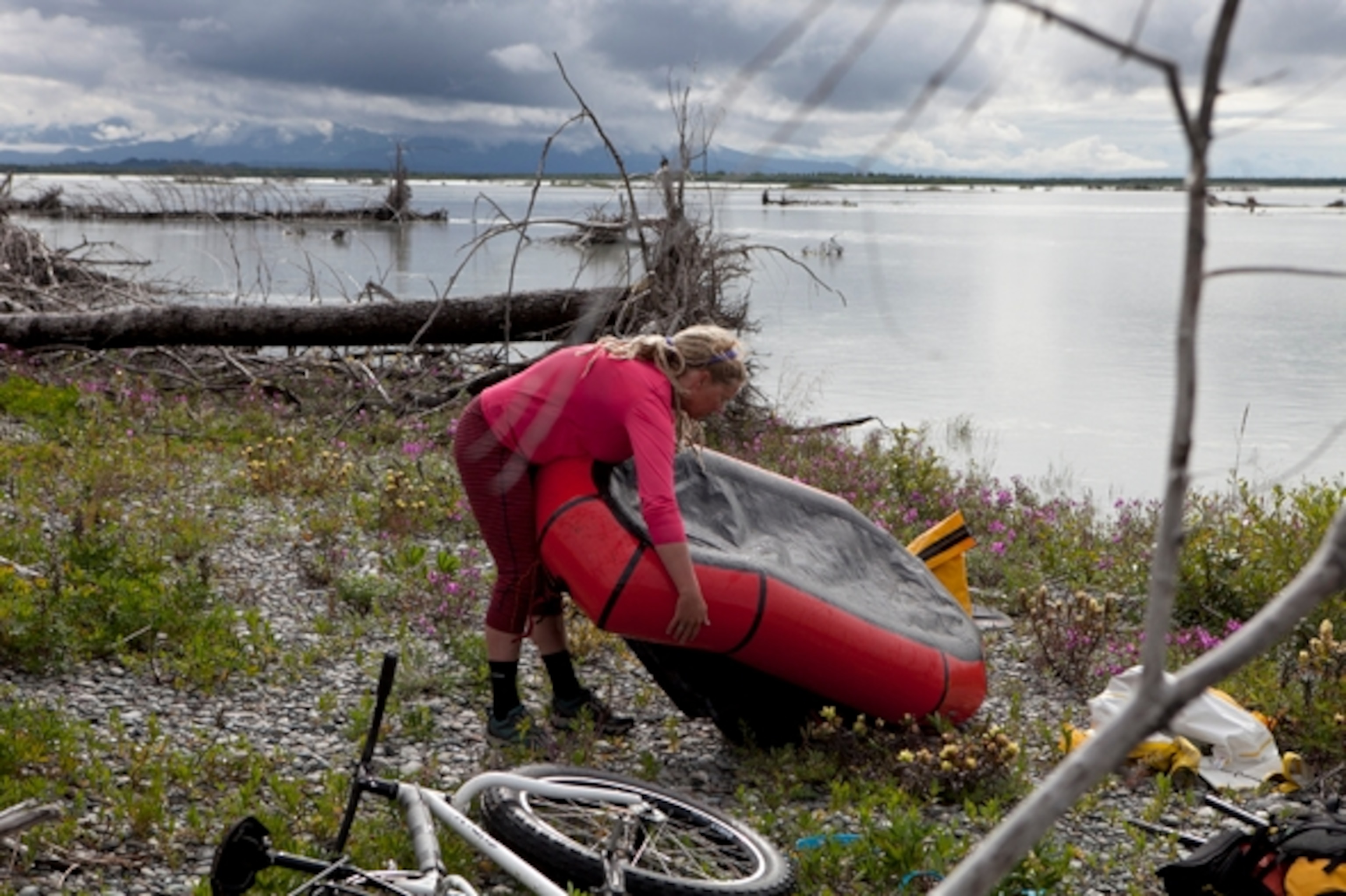 Iris prepares her raft and equipment for crossing the Alsek; photograph by Cameron Lawson