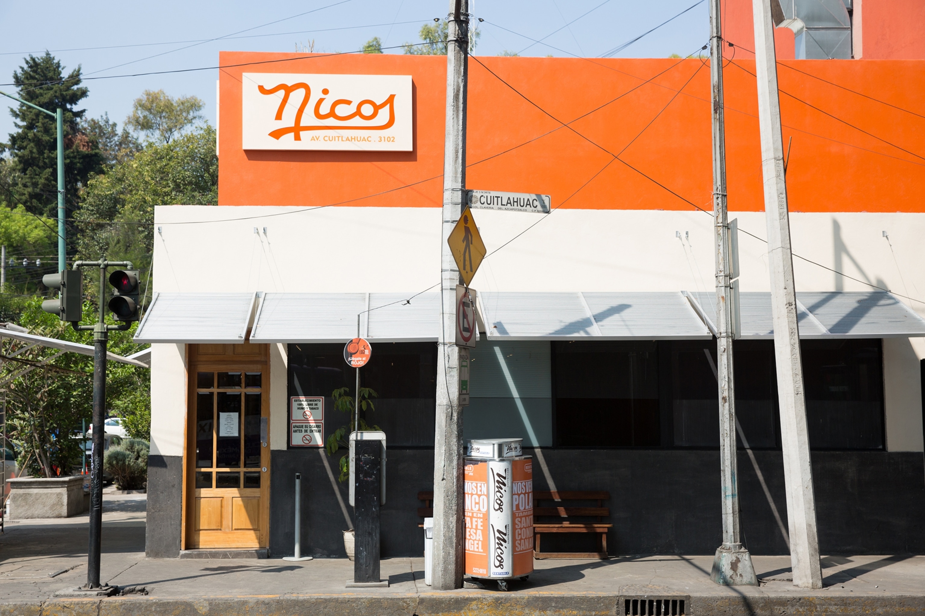 The street view of a plain-looking restaurant with a simple sign carrying the restaurant's name.