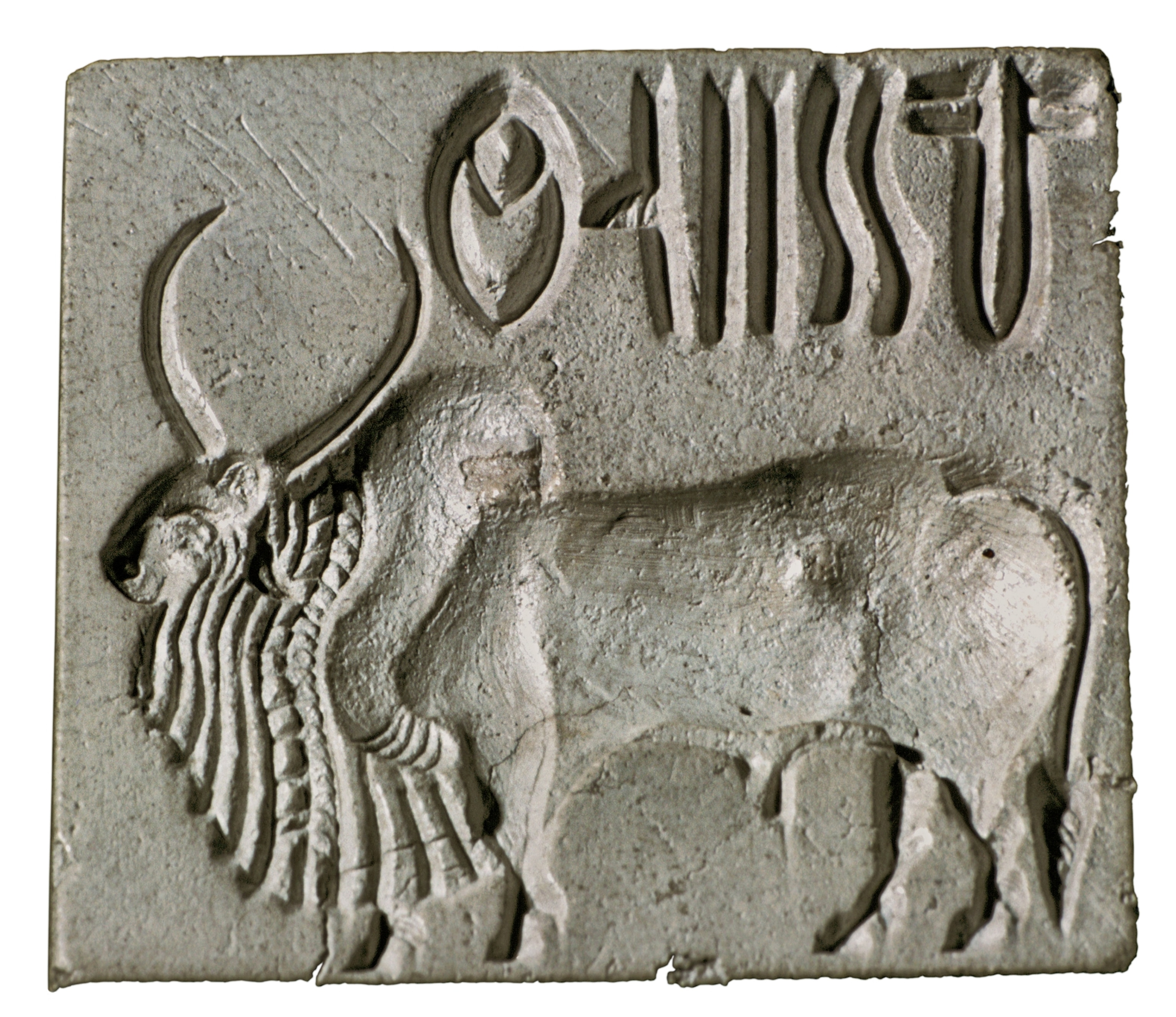 A square gray seal with an animal and characters etched onto it.