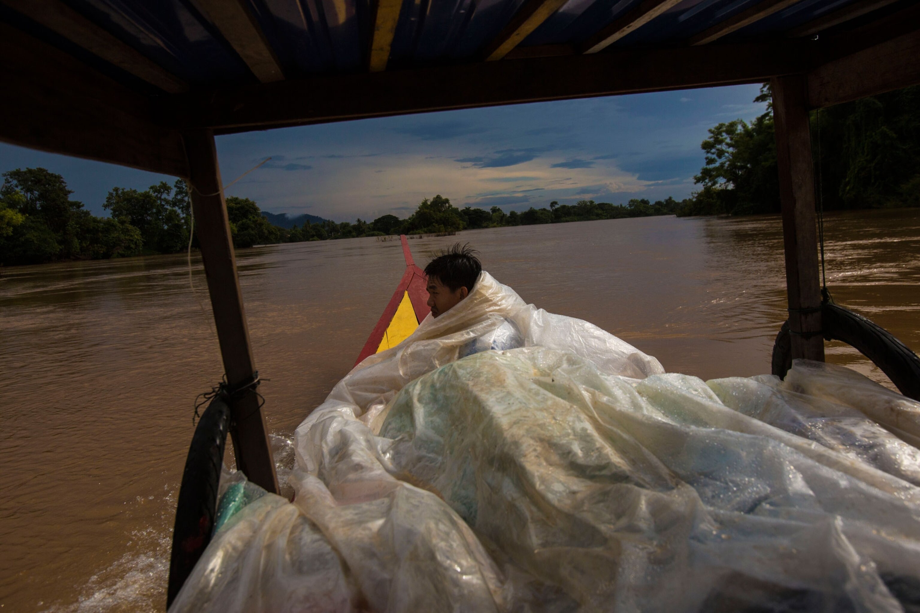 a boat in Laos during a rain storm.
