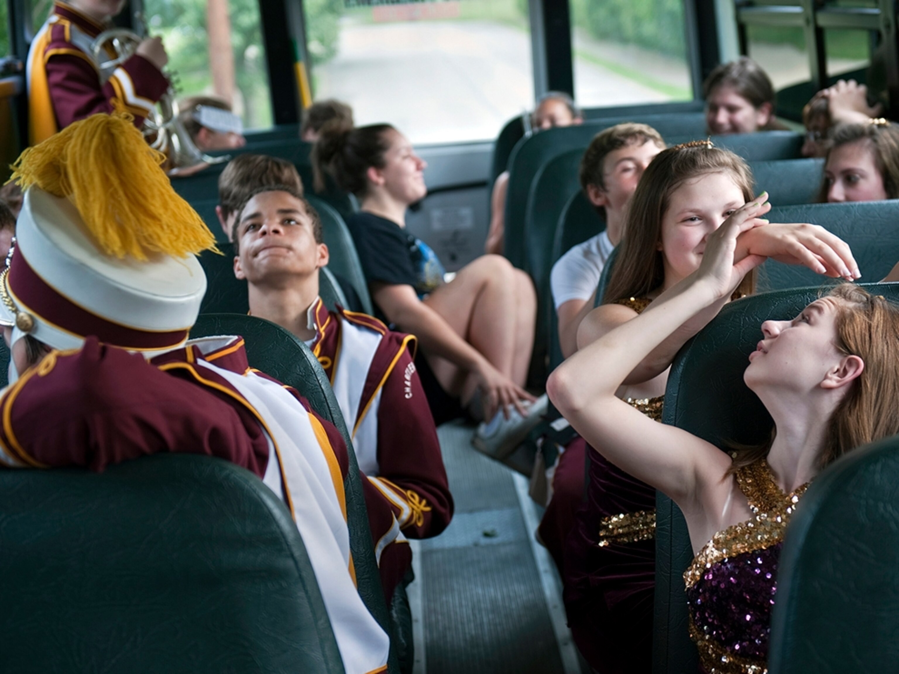 Marching band members ride the bus home after performing in the Canonsburg, Pennsylvania, Memorial Day Parade.