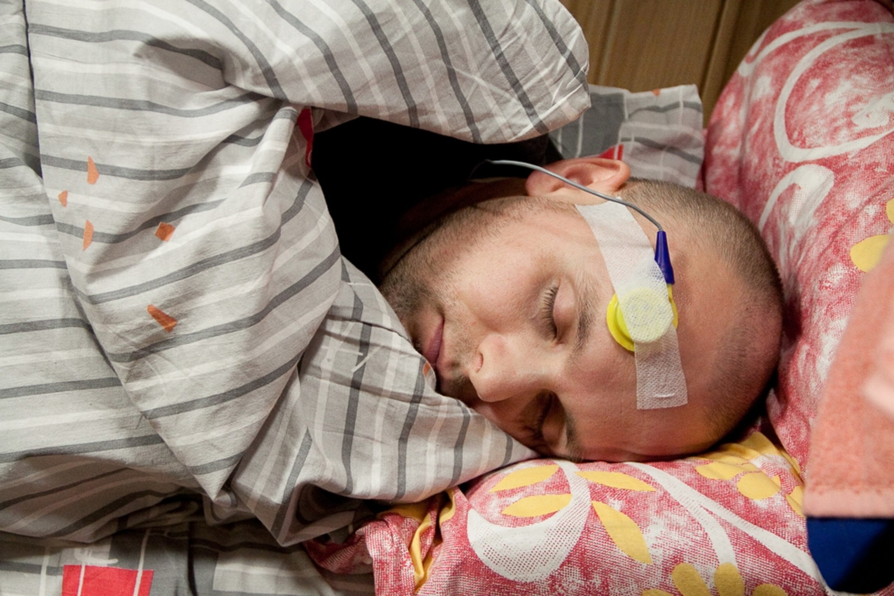 Mars 500 picture: Sleeping crew member wearing electrodes