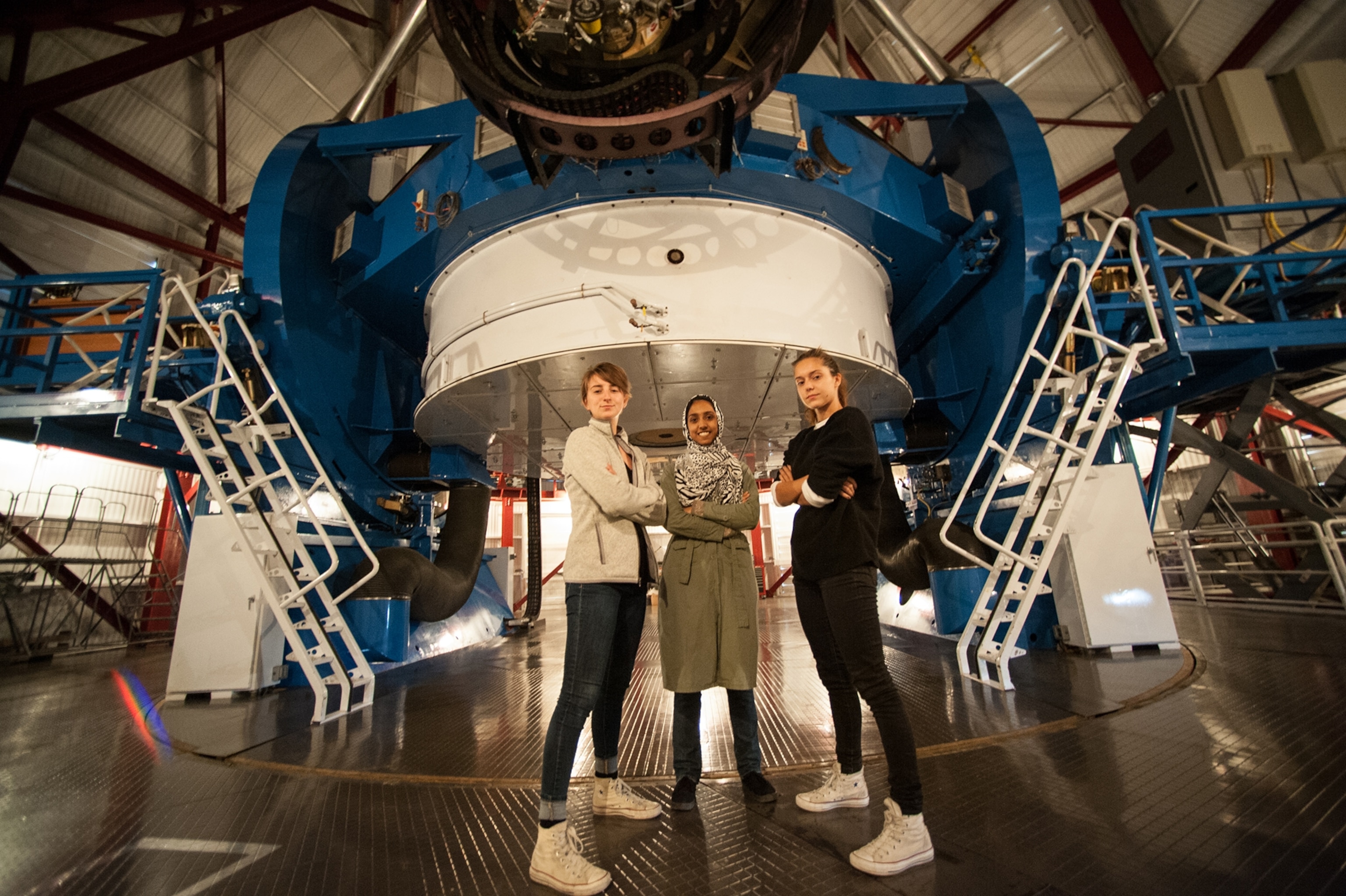 Munazza Alam and two other women at the Magellan 1 Baade telescope
