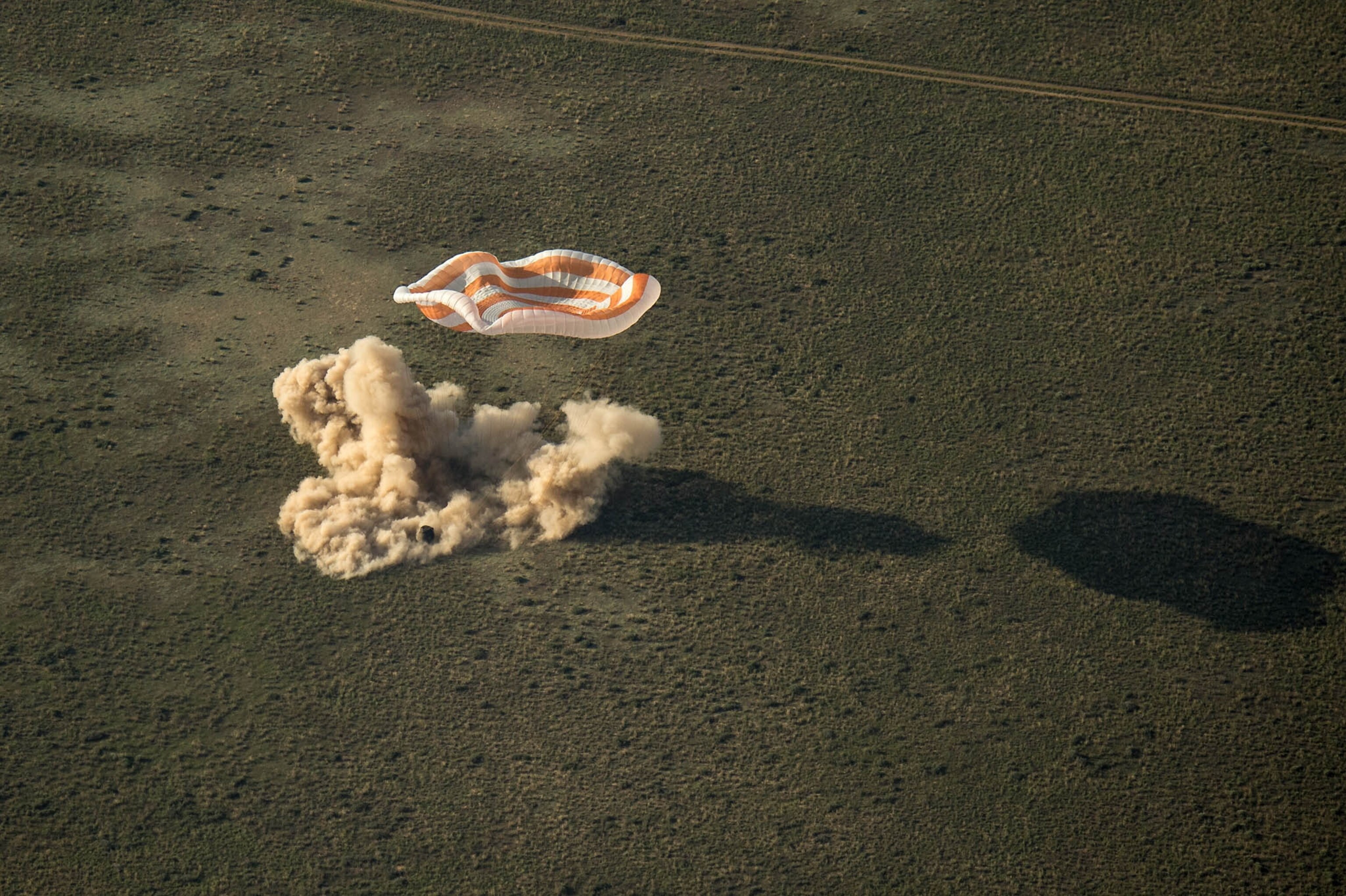 A sokol suit helmet can be seen against the window of the Soyuz TMA-11M capsule shortly after the spacecraft landed with Expedition 39 Commander Koichi Wakata of the Japan Aerospace Exploration Agency (JAXA), Soyuz Commander Mikhail Tyurin of Roscosmos, and Flight Engineer Rick Mastracchio of NASA near the town of Zhezkazgan, Kazakhstan on Wednesday, May 14, 2014.