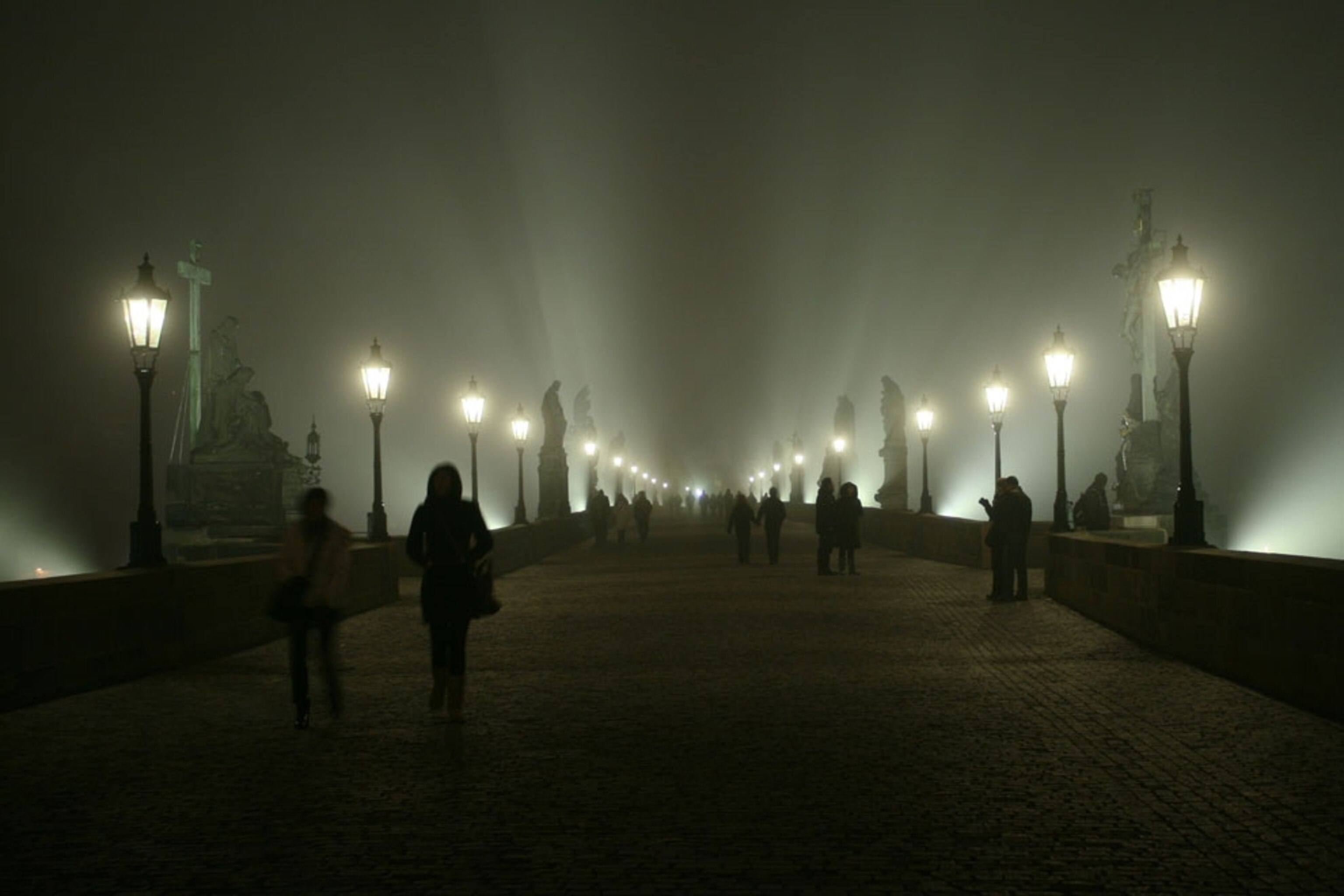 Fog on Prague's Charles Bridge at night