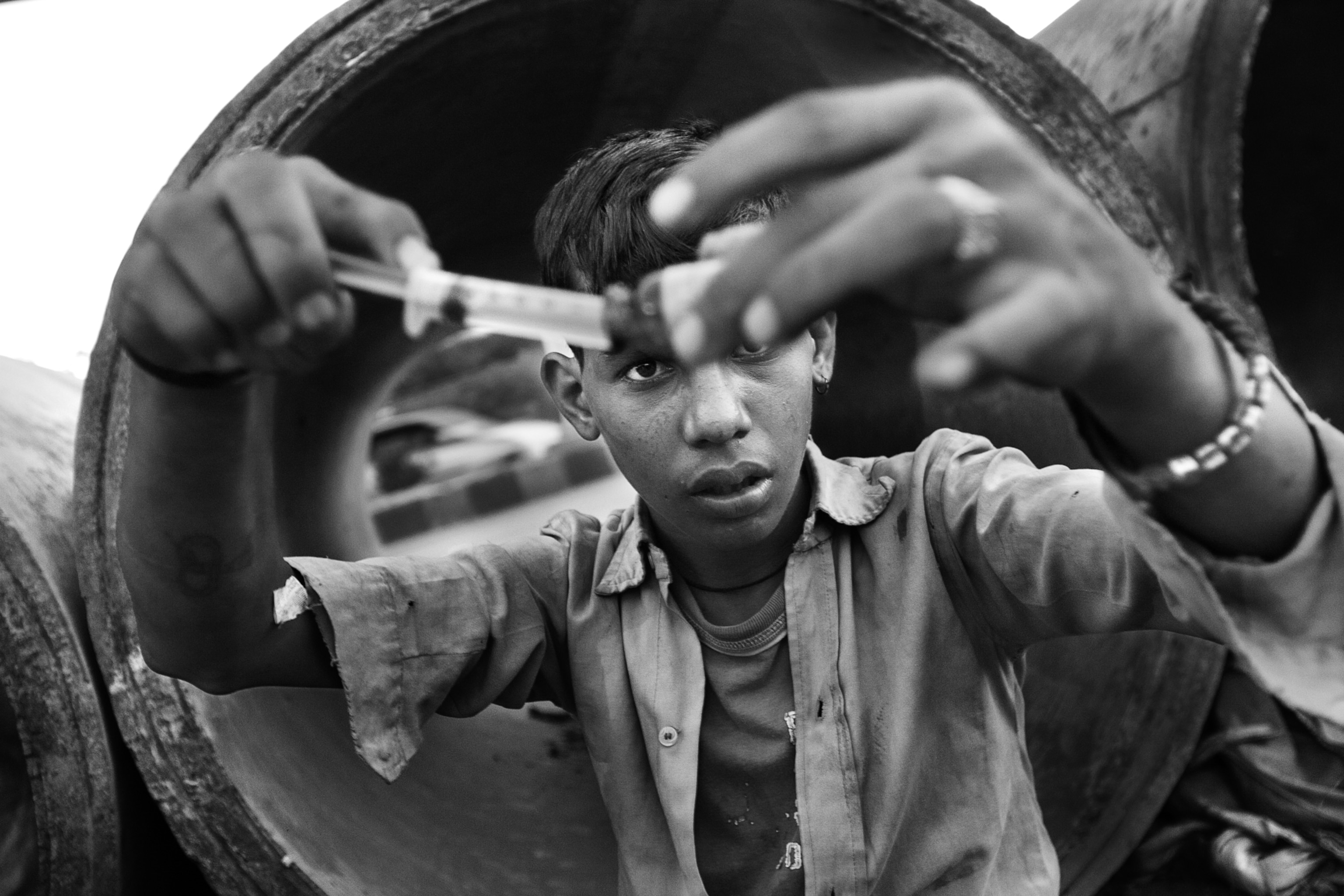 A 16-year-old boy prepares one of his daily injections. A so-called “set”, consisting of an ampule of Buprenorphine (semi-synthetic opioid), an ampule of Diazepam (Valium), an ampule of Avil (an antihistamine,) and two disposable syringes is sold for 50 rupees—a little less than $1. Regular customers of the local pharmacies sometimes even get a discount or an extra strong painkiller tablet for free