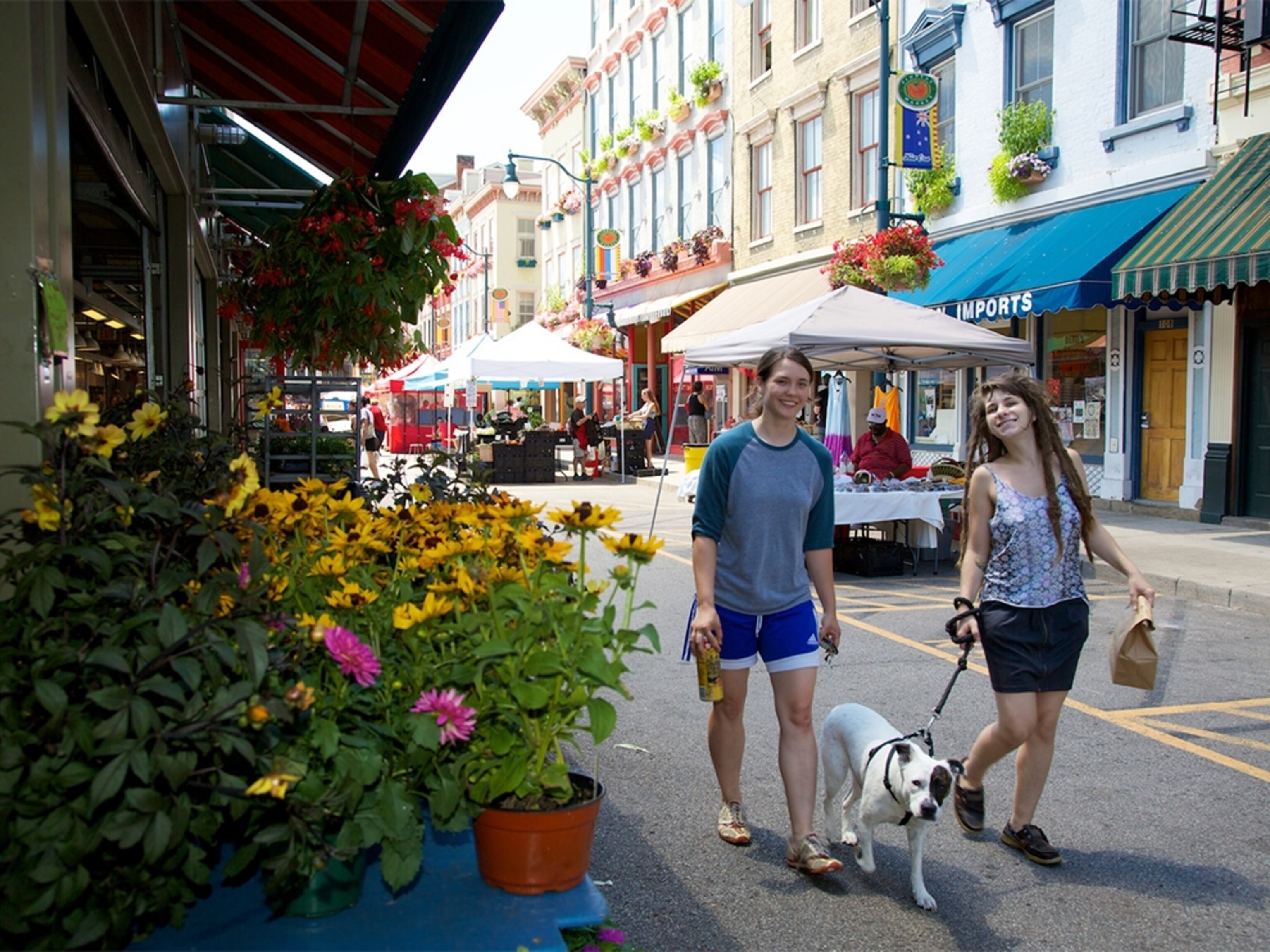 pedestrians passing a flower market in Cincinnati, Ohio