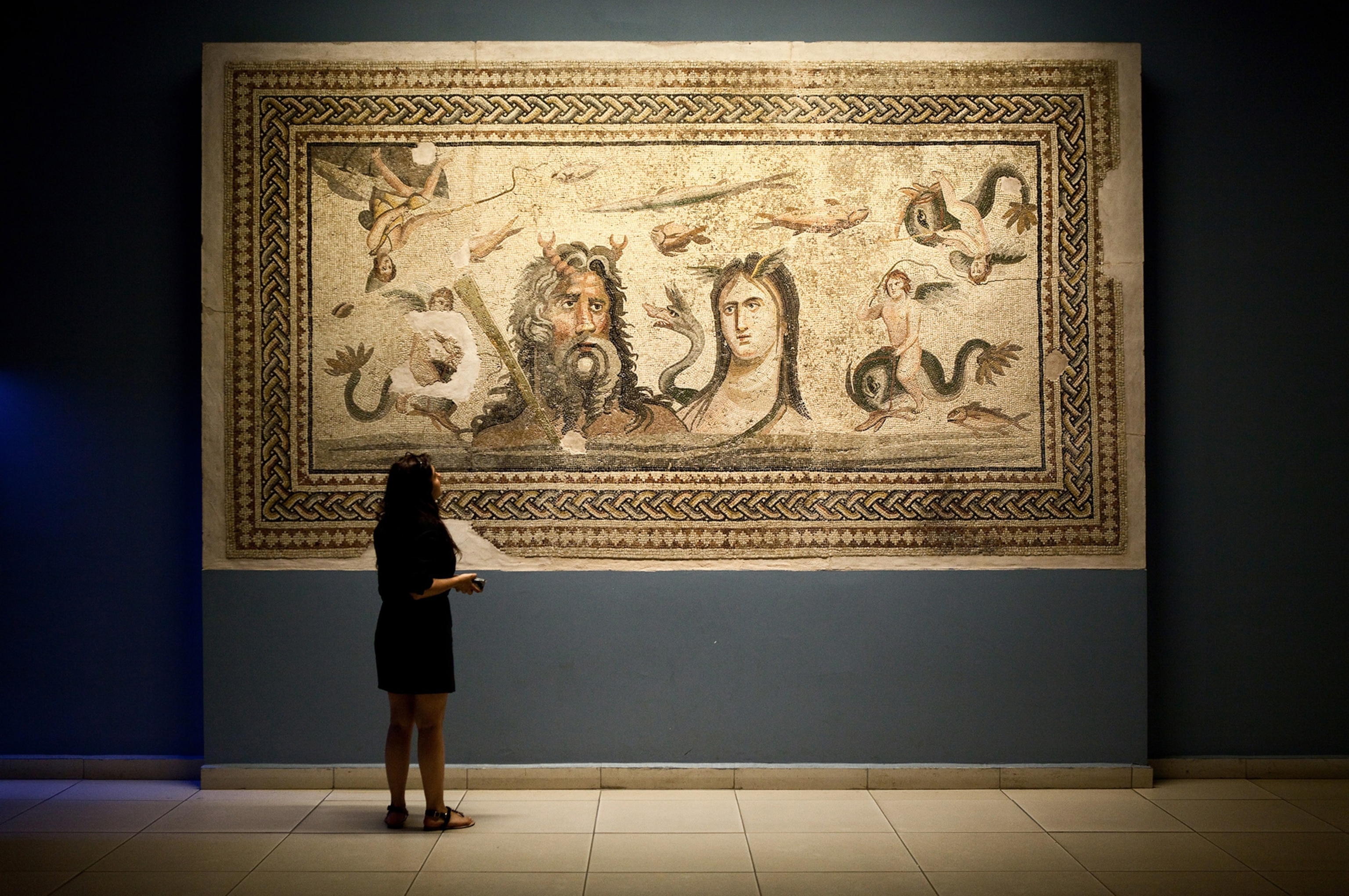 A visitor looks at a mosaic of the river god Oceanus and his wife Tethys at Zeugma Mosaic Museum, which holds impressive third- and fourth-century mosaics unearthed from the Roman site of Belkis-Zeugma, in Gaziantep, Turkey. Gaziantep, known as the baklava capital of Turkey, boasts some 100 baklava shops and produces 90 percent of the baklava consumed in Turkey.