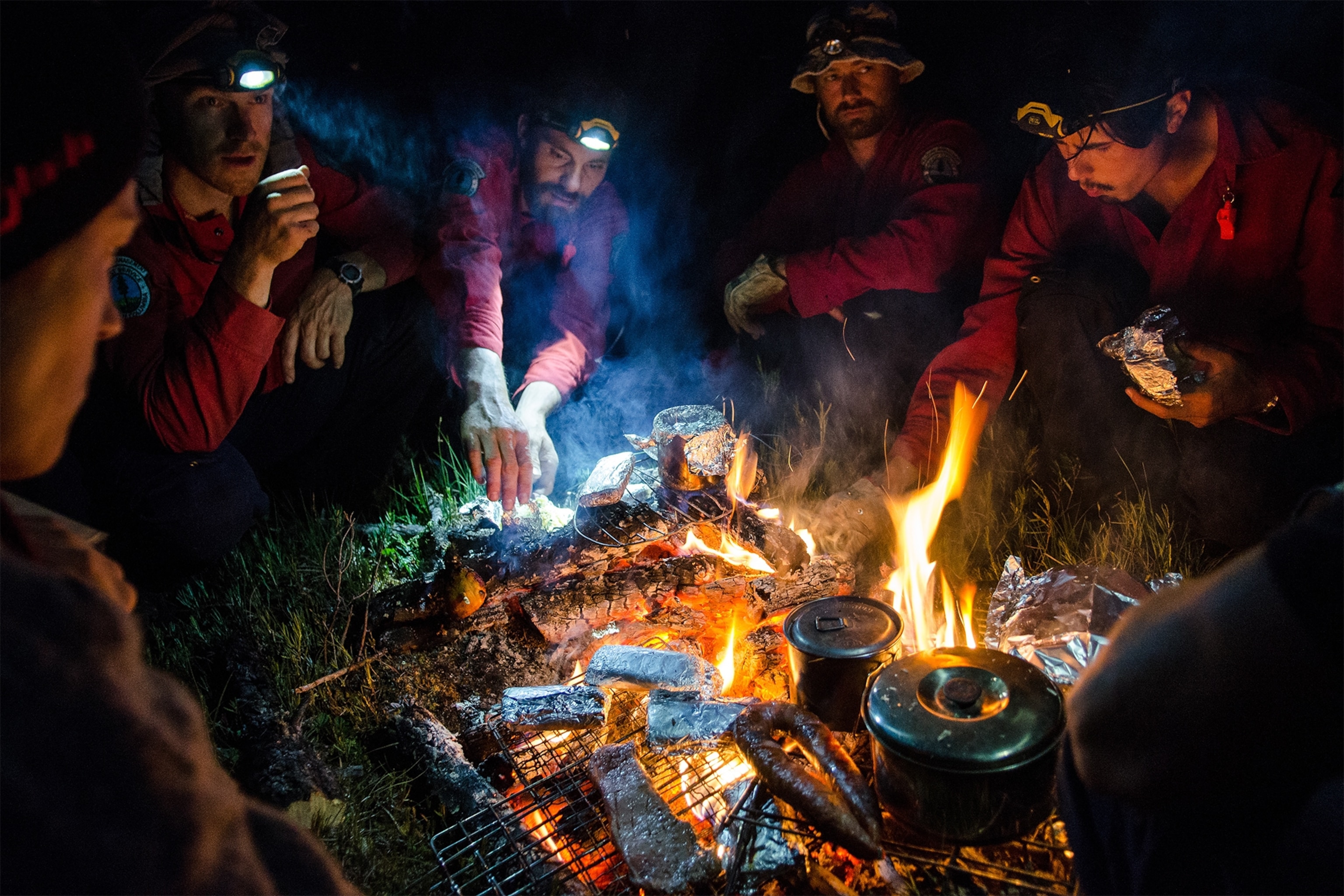 members of the North Peace Smokejumpers cooking dinner in British Columbia